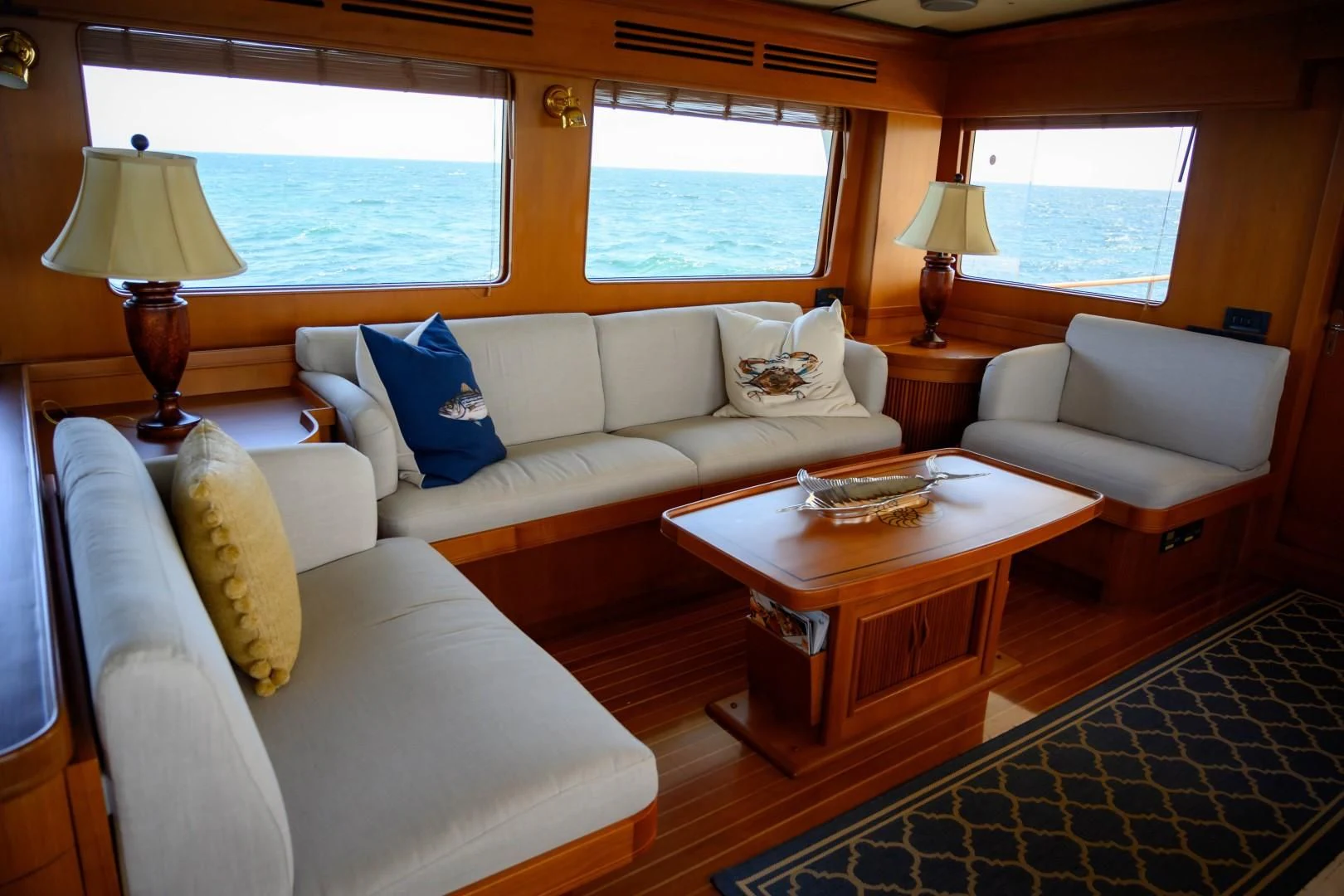 a living room with a couch and a coffee table aboard VK Yacht for Sale