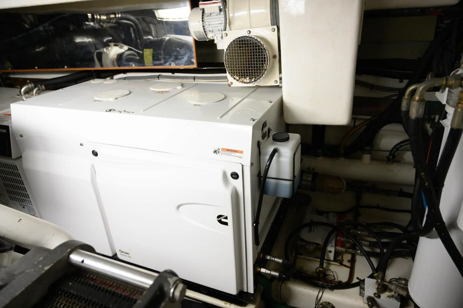 a white machine with a metal frame aboard VK Yacht for Sale