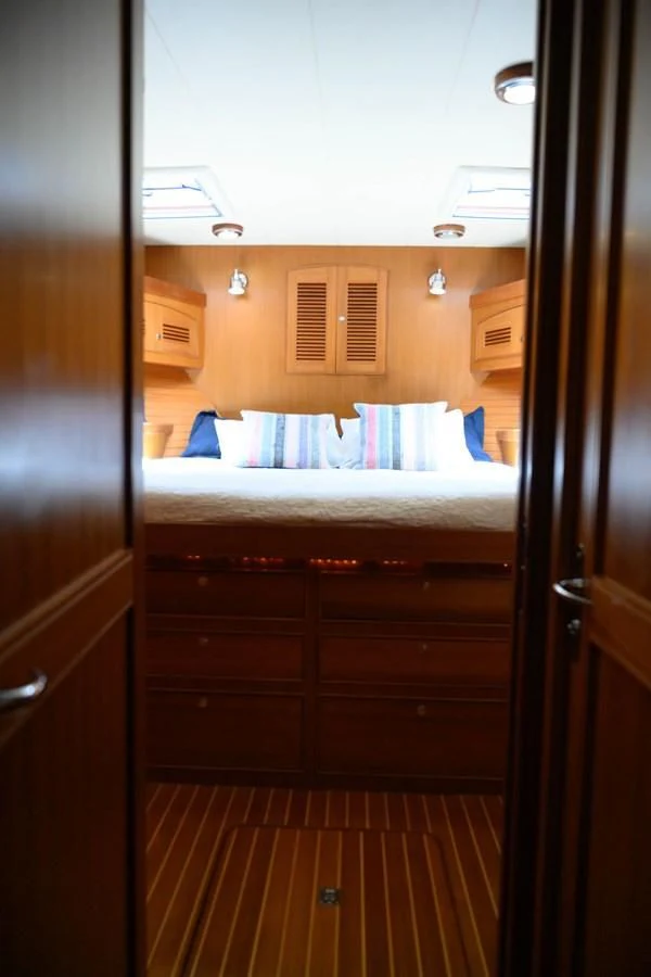 a bedroom with a bed aboard VK Yacht for Sale