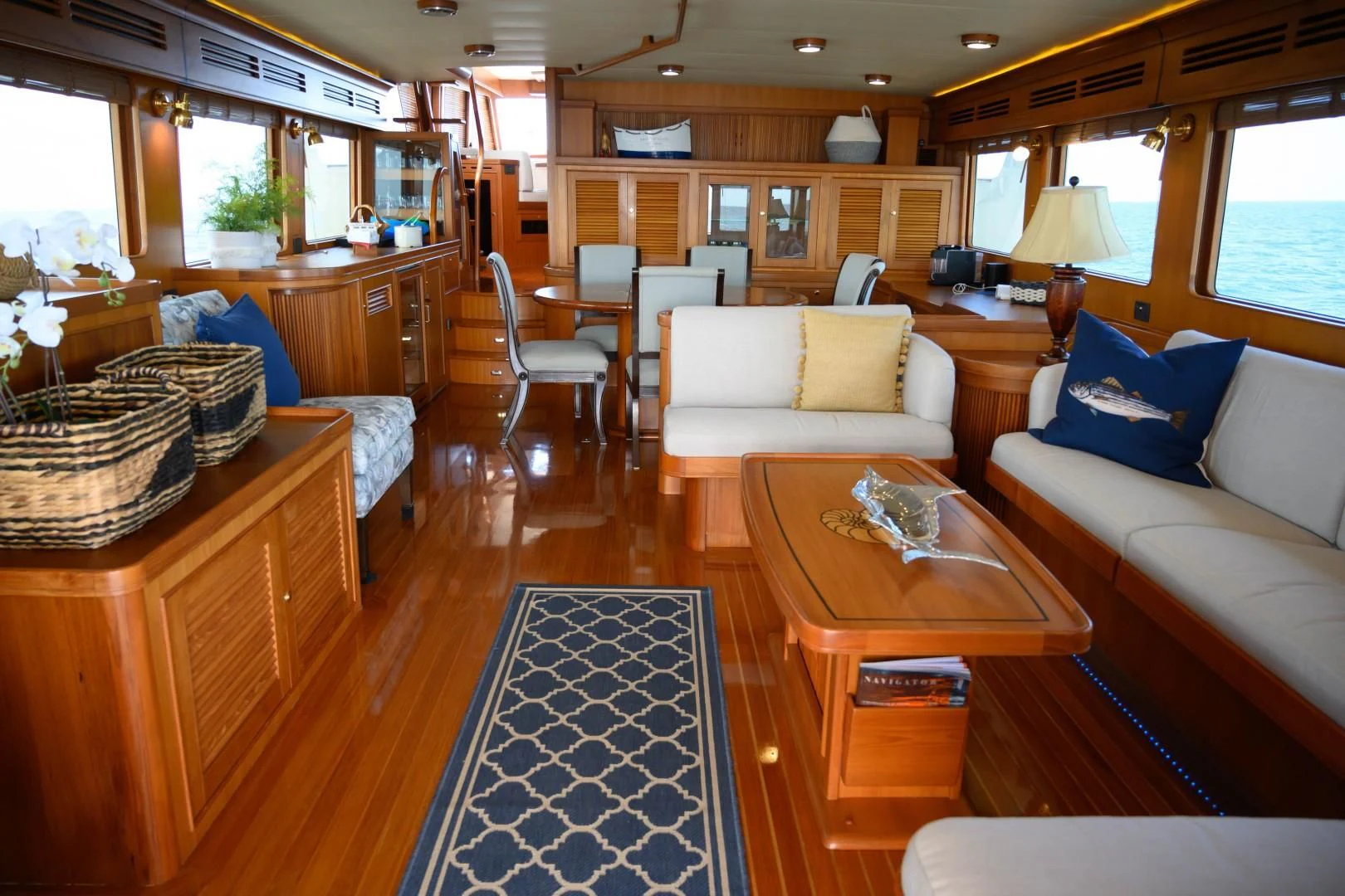 a living room with a couch and a coffee table aboard VK Yacht for Sale