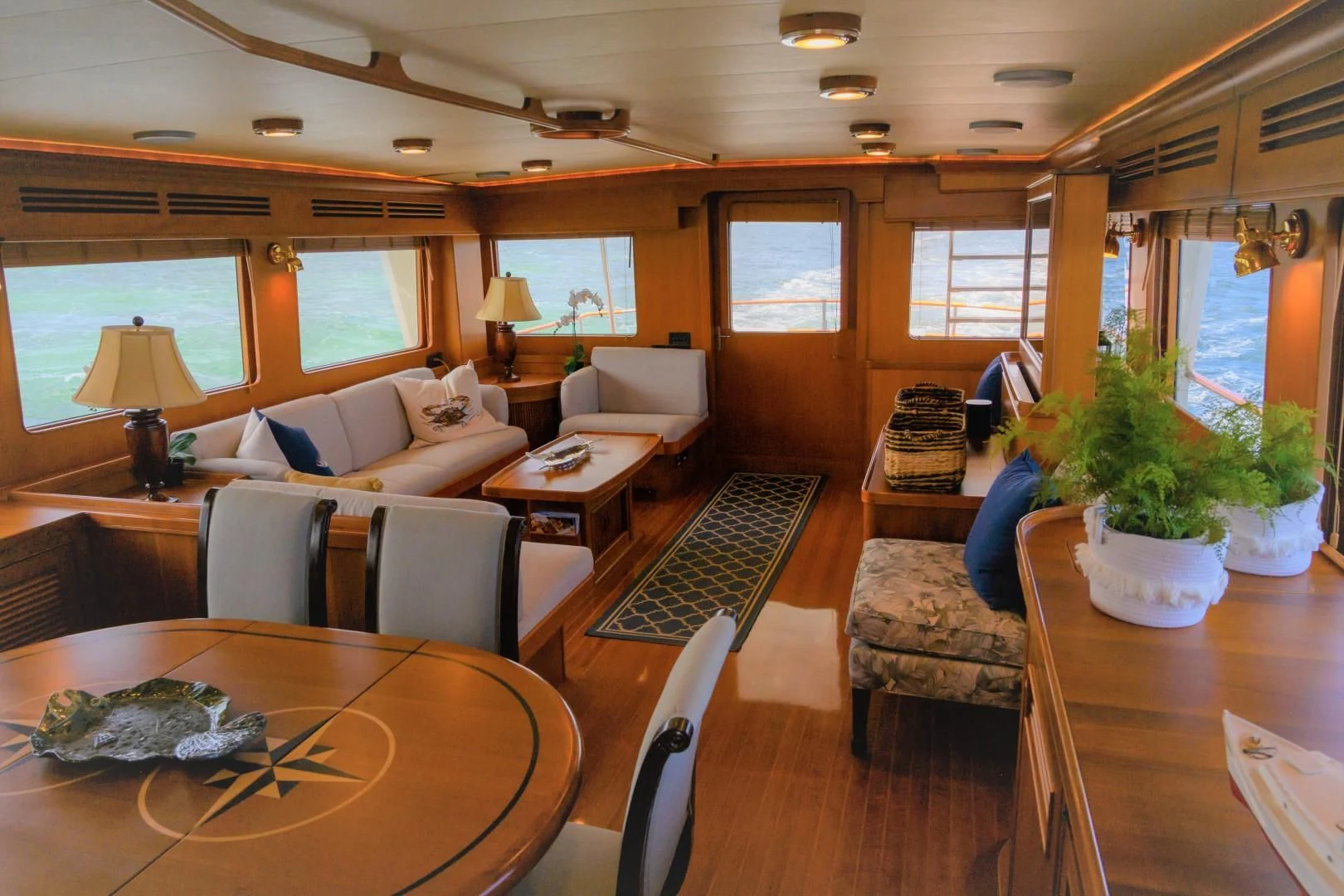a living room with a large window aboard VK Yacht for Sale