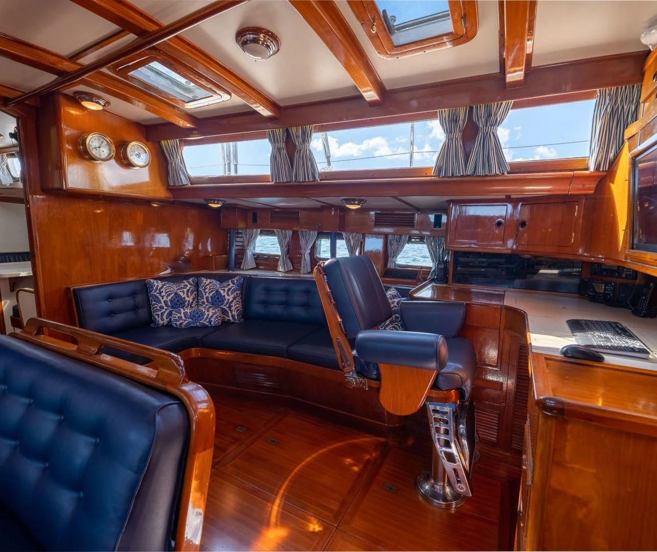 a room with a desk and chairs aboard HERMIE LOUISE Yacht for Sale