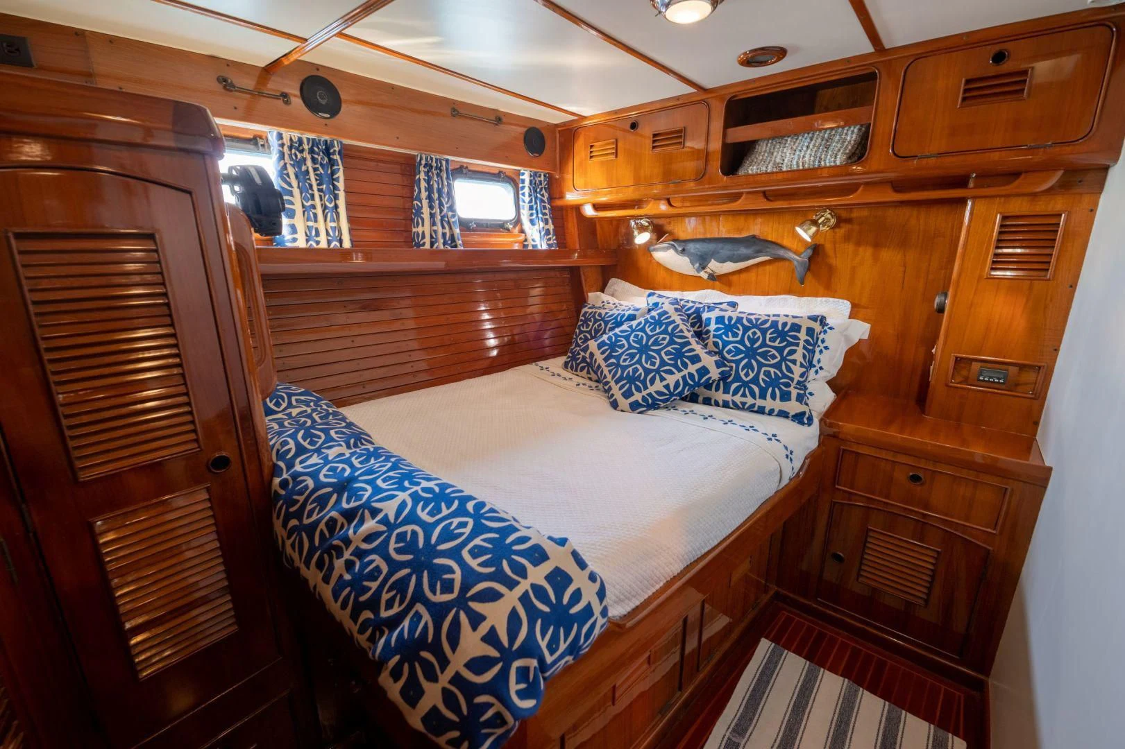a cabin with a bed and a chair aboard HERMIE LOUISE Yacht for Sale