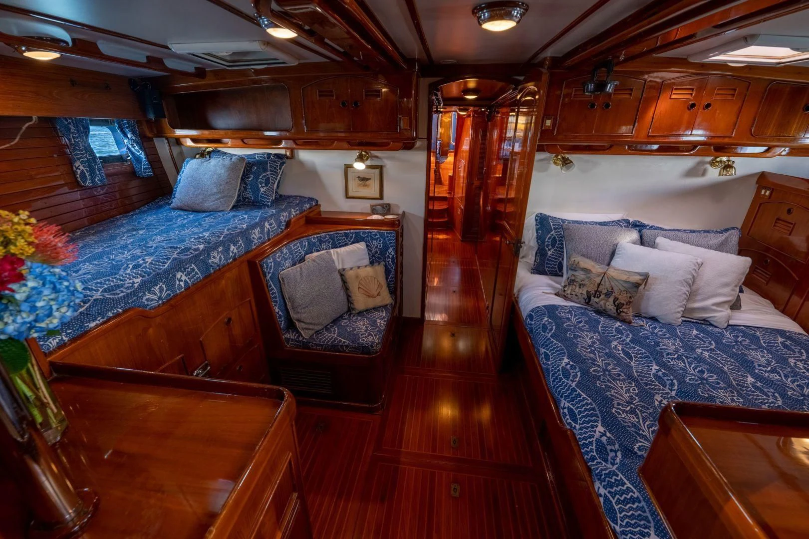 a room with a bed and a chair aboard HERMIE LOUISE Yacht for Sale
