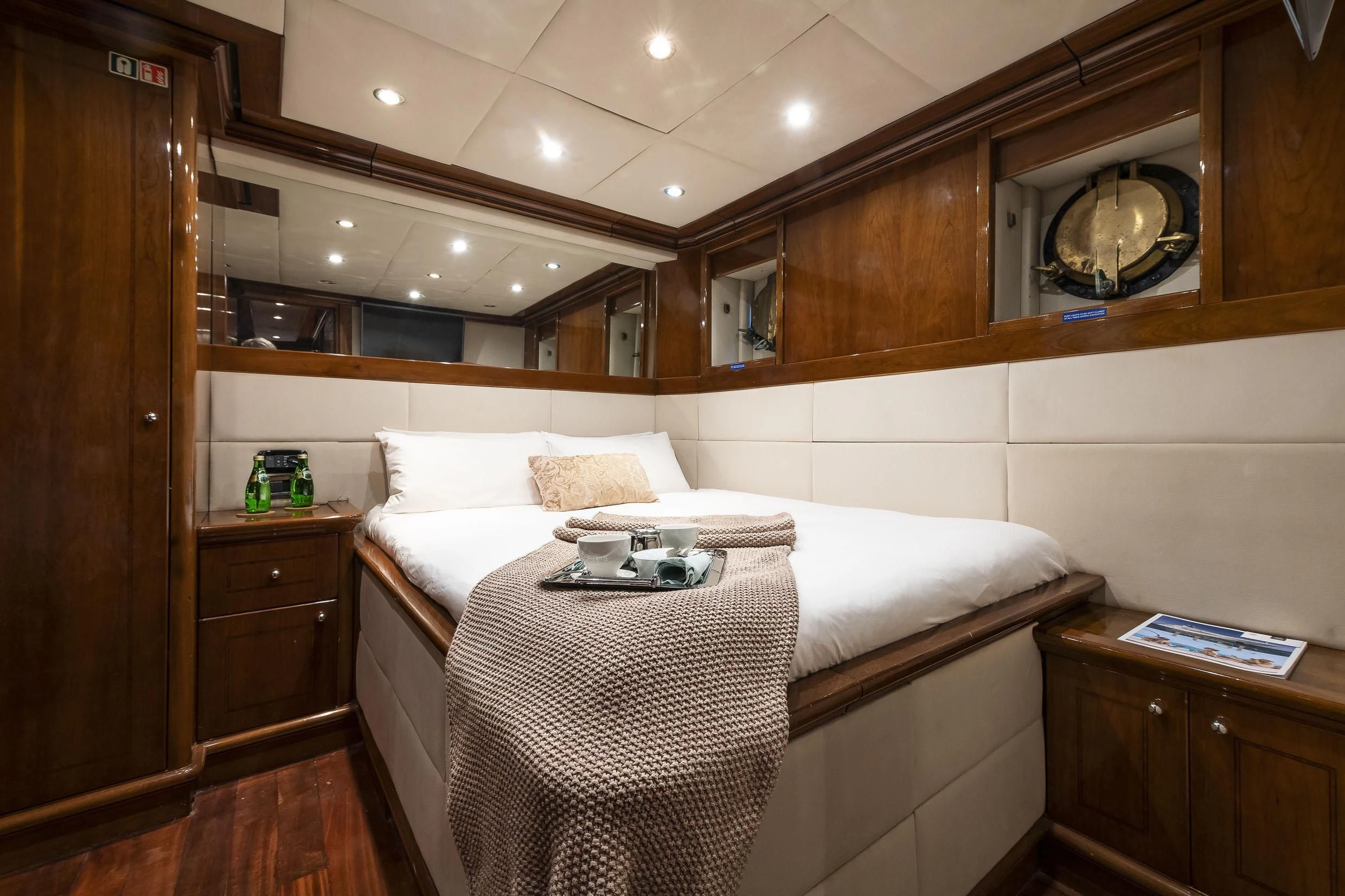 a bed with a white sheet and a white bed spread aboard 2 LADIES Yacht for Sale