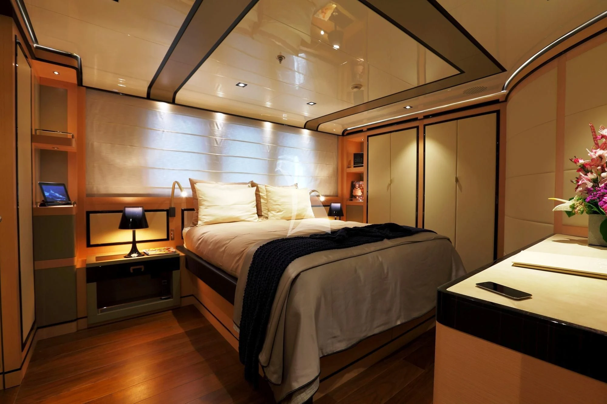 a bedroom with a large mirror aboard 2 LADIES Yacht for Sale