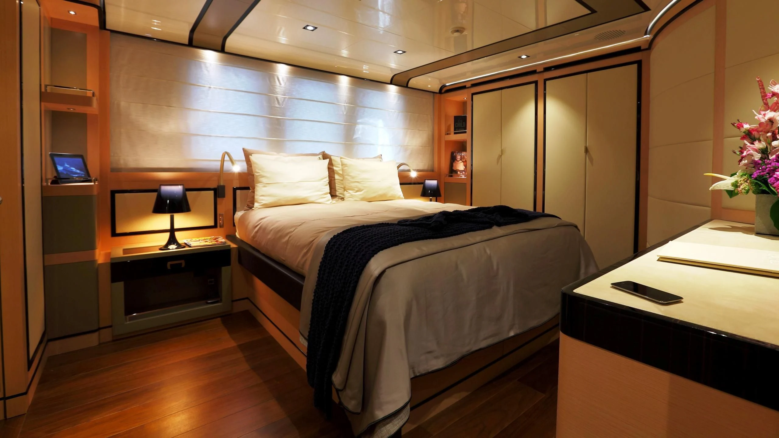 a bedroom with a bed and desk aboard 2 LADIES Yacht for Sale