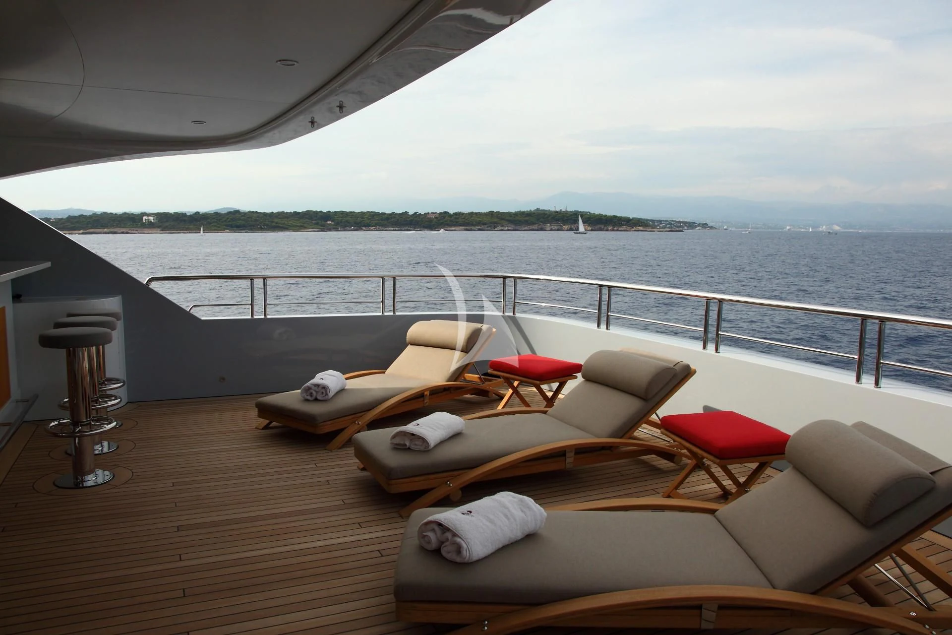 a deck with a view of the water and the land below aboard 2 LADIES Yacht for Sale