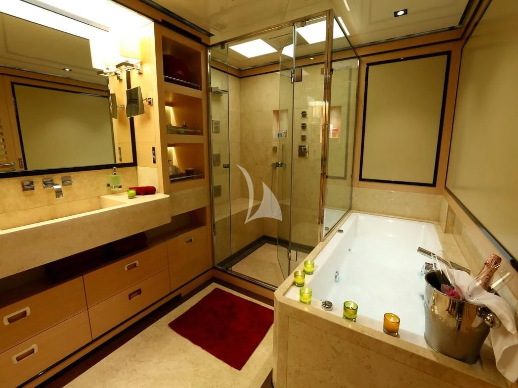 a bathroom with a tub and shower aboard 2 LADIES Yacht for Sale