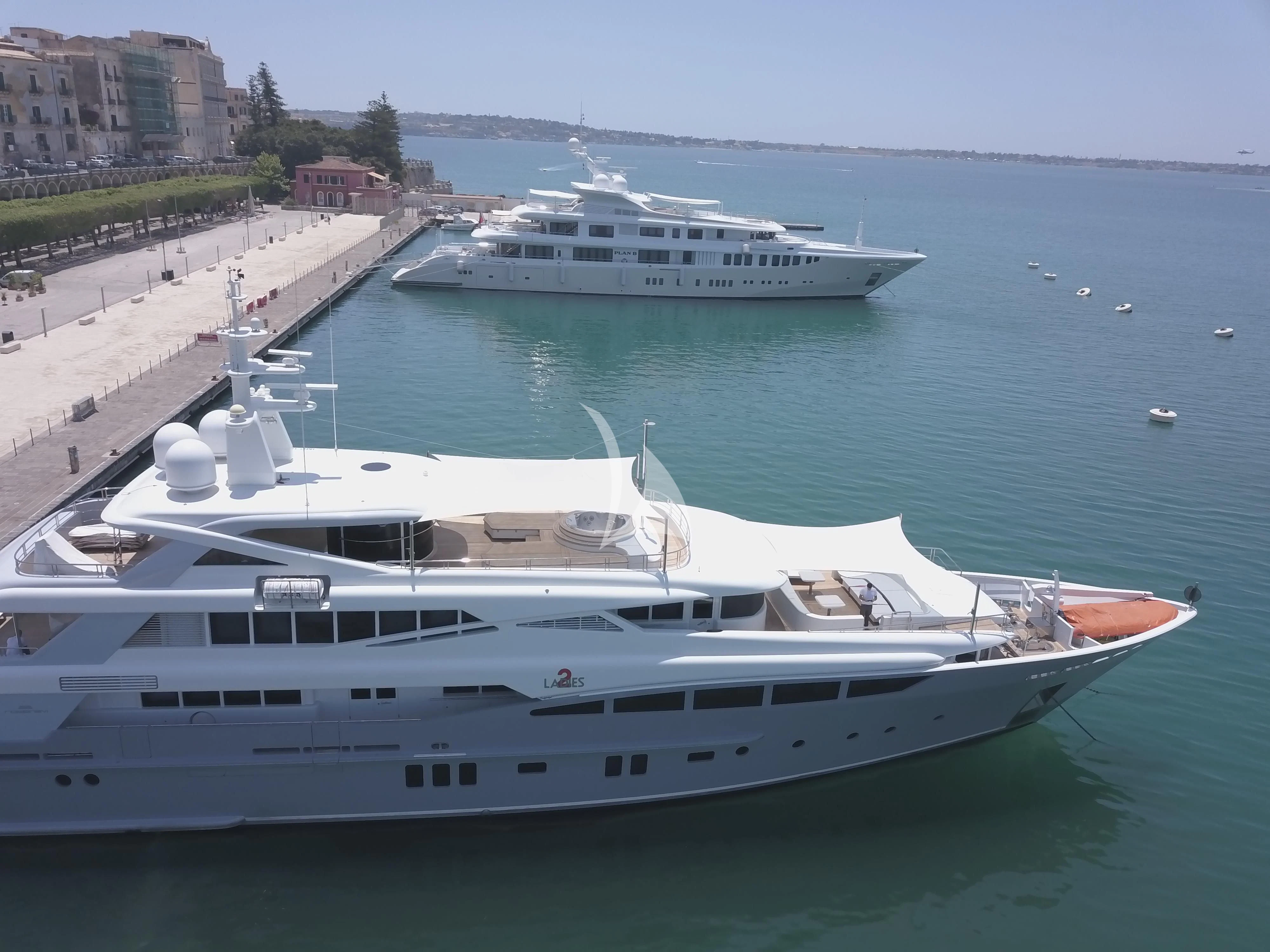 a couple of white yachts in a harbor aboard 2 LADIES Yacht for Sale