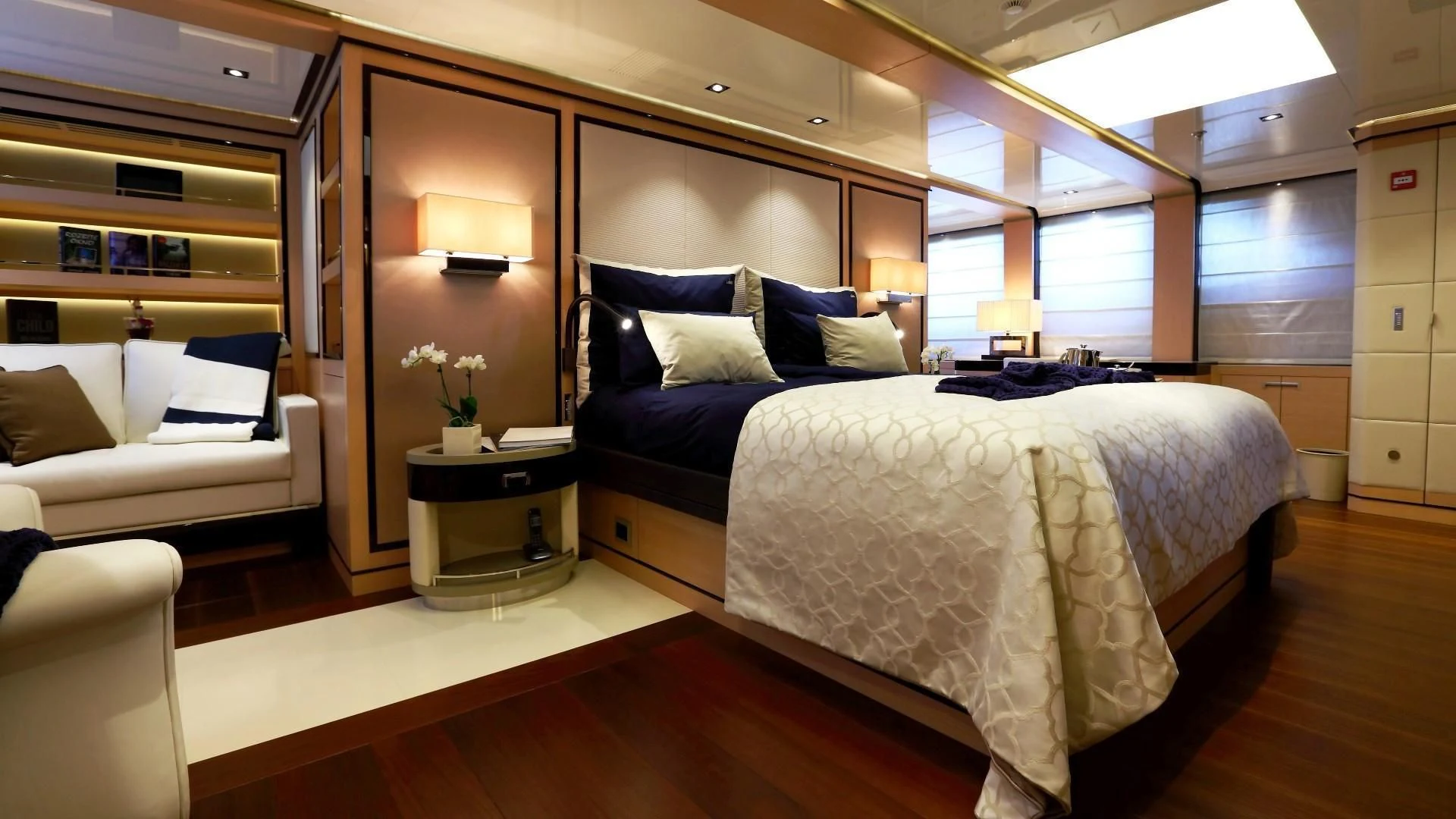 a bedroom with a bed and a couch aboard 2 LADIES Yacht for Sale