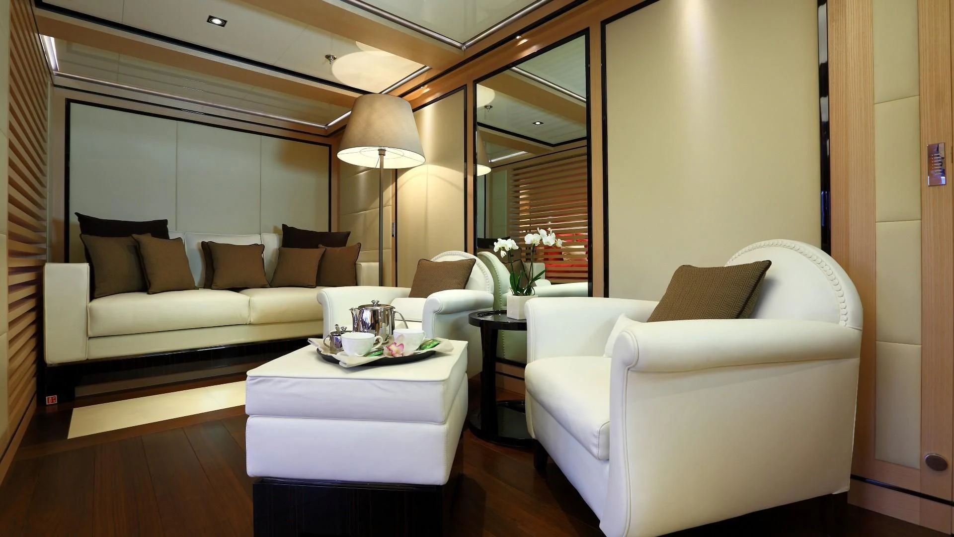 a living room with a couch and a table aboard 2 LADIES Yacht for Sale