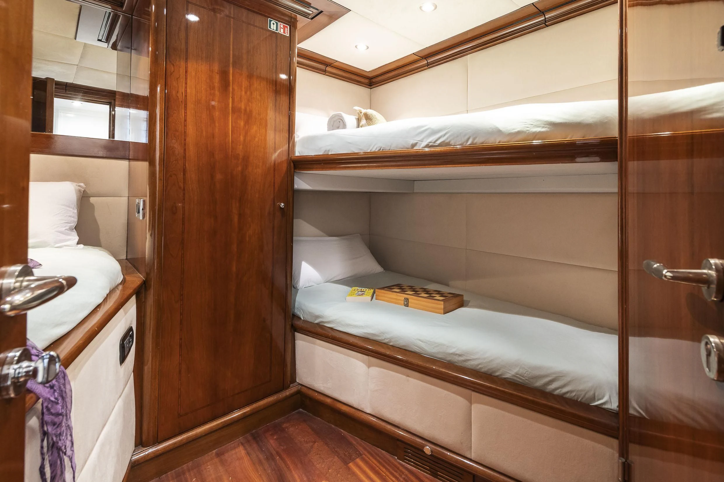 a bathroom with a wooden door aboard 2 LADIES Yacht for Sale