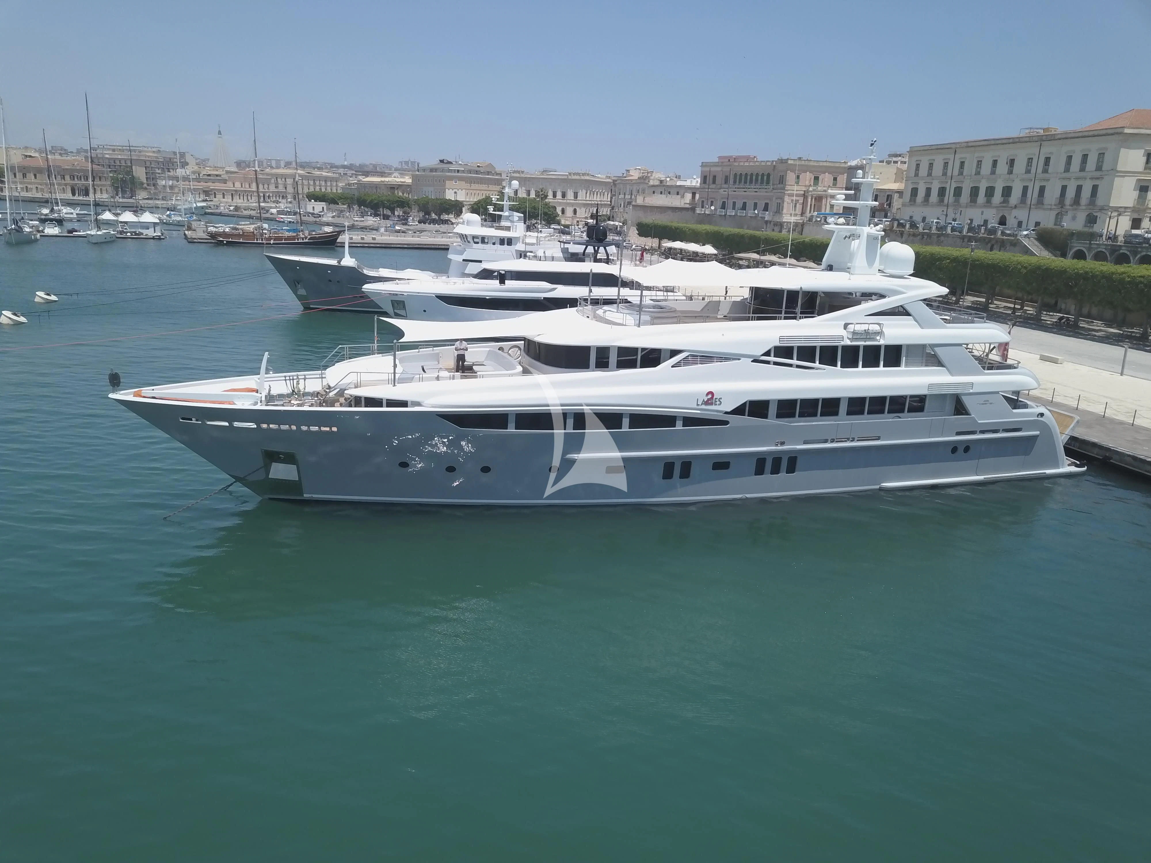 a large white yacht in the water aboard 2 LADIES Yacht for Sale
