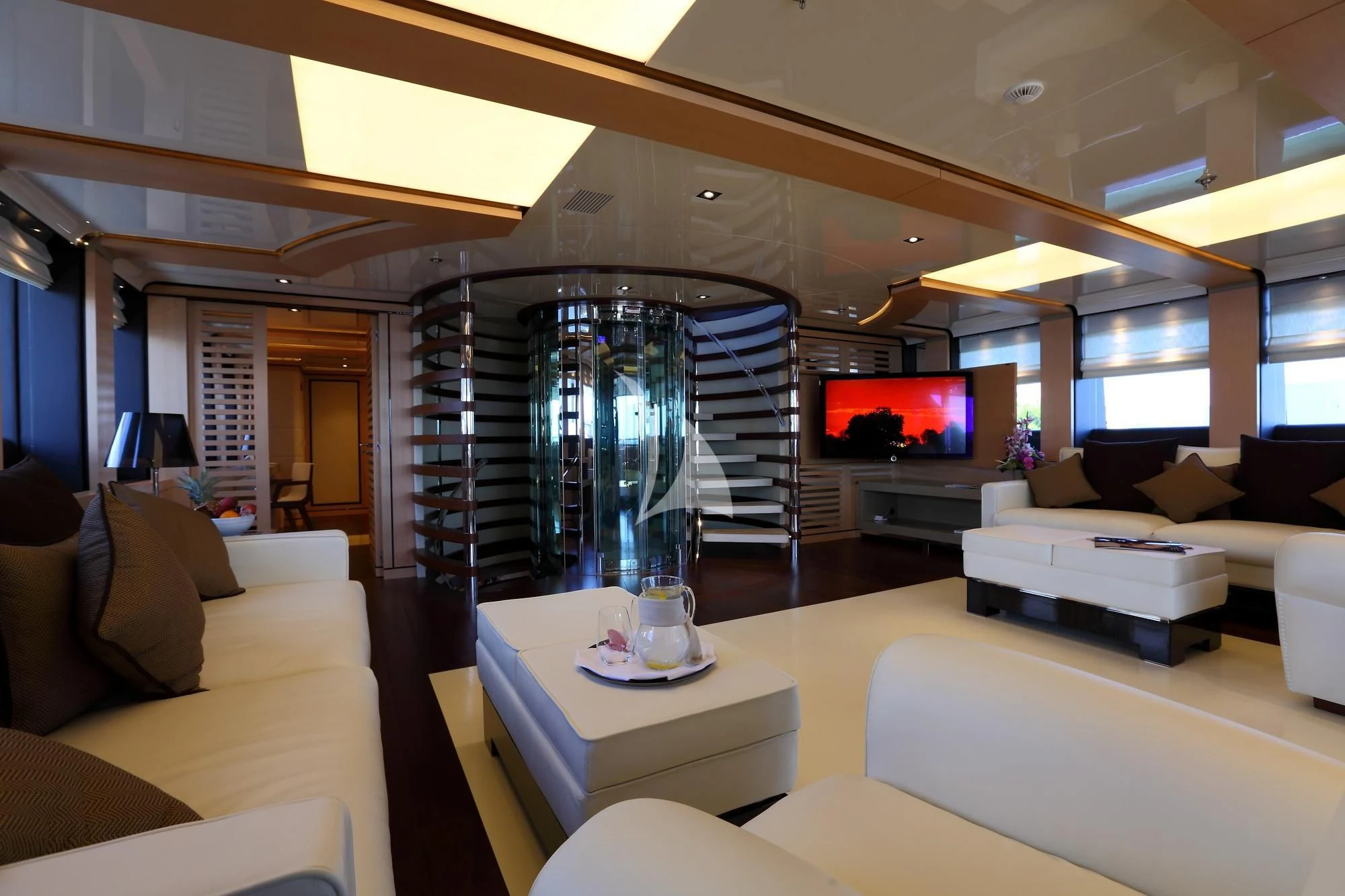 a living room with a glass fish tank aboard 2 LADIES Yacht for Sale