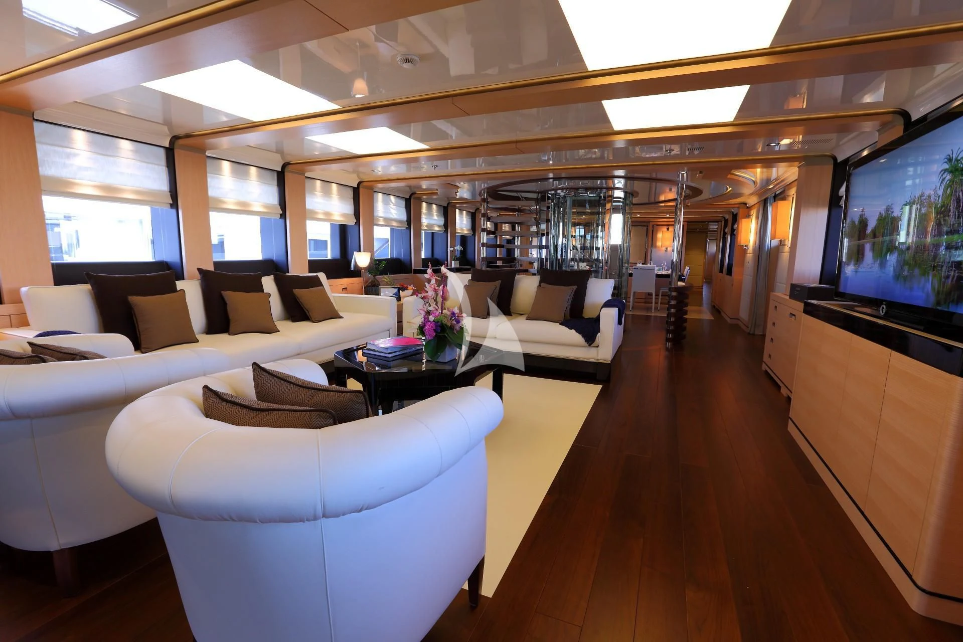 a room with couches and a television aboard 2 LADIES Yacht for Sale