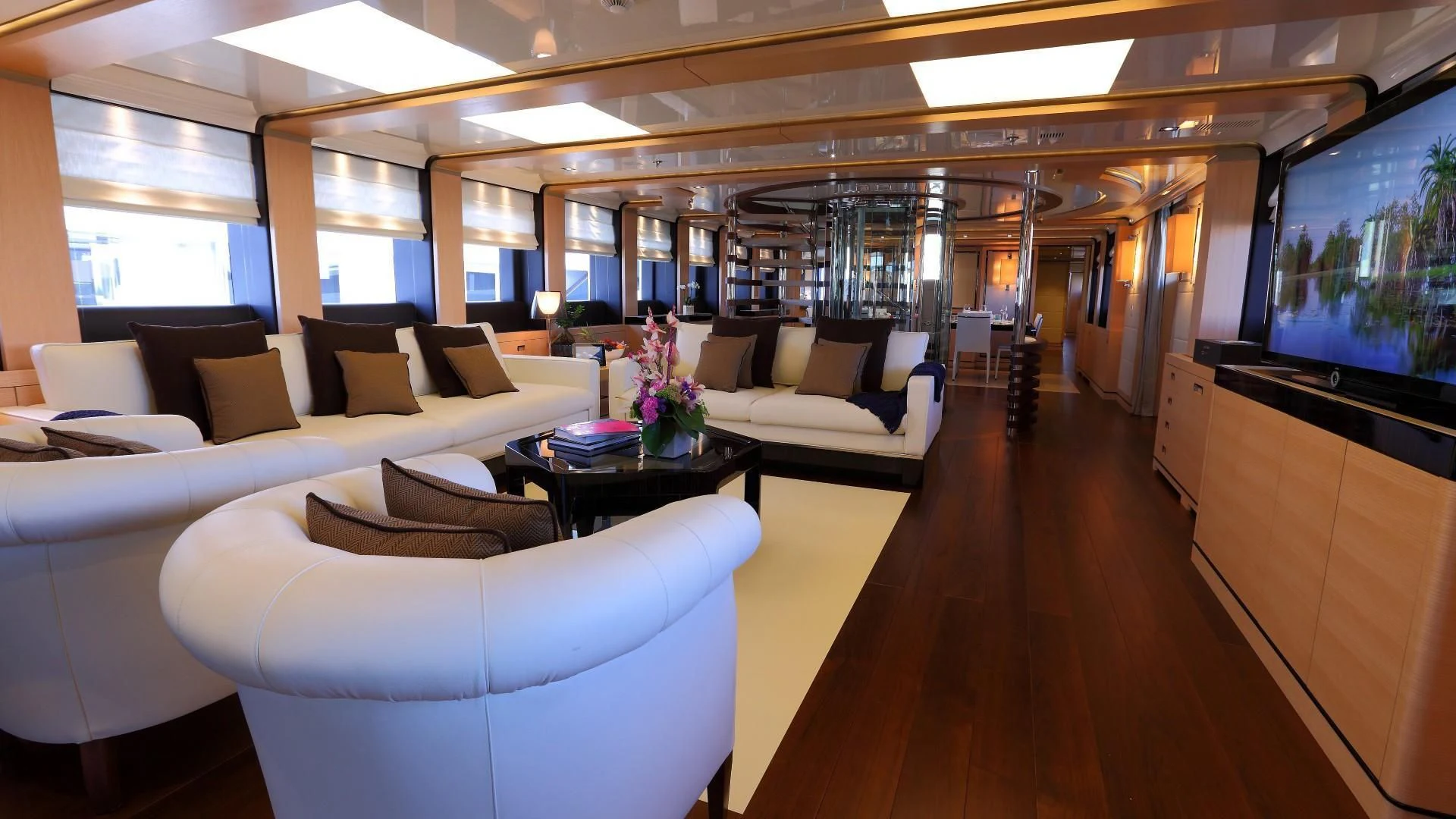 a room with couches and a television aboard 2 LADIES Yacht for Sale
