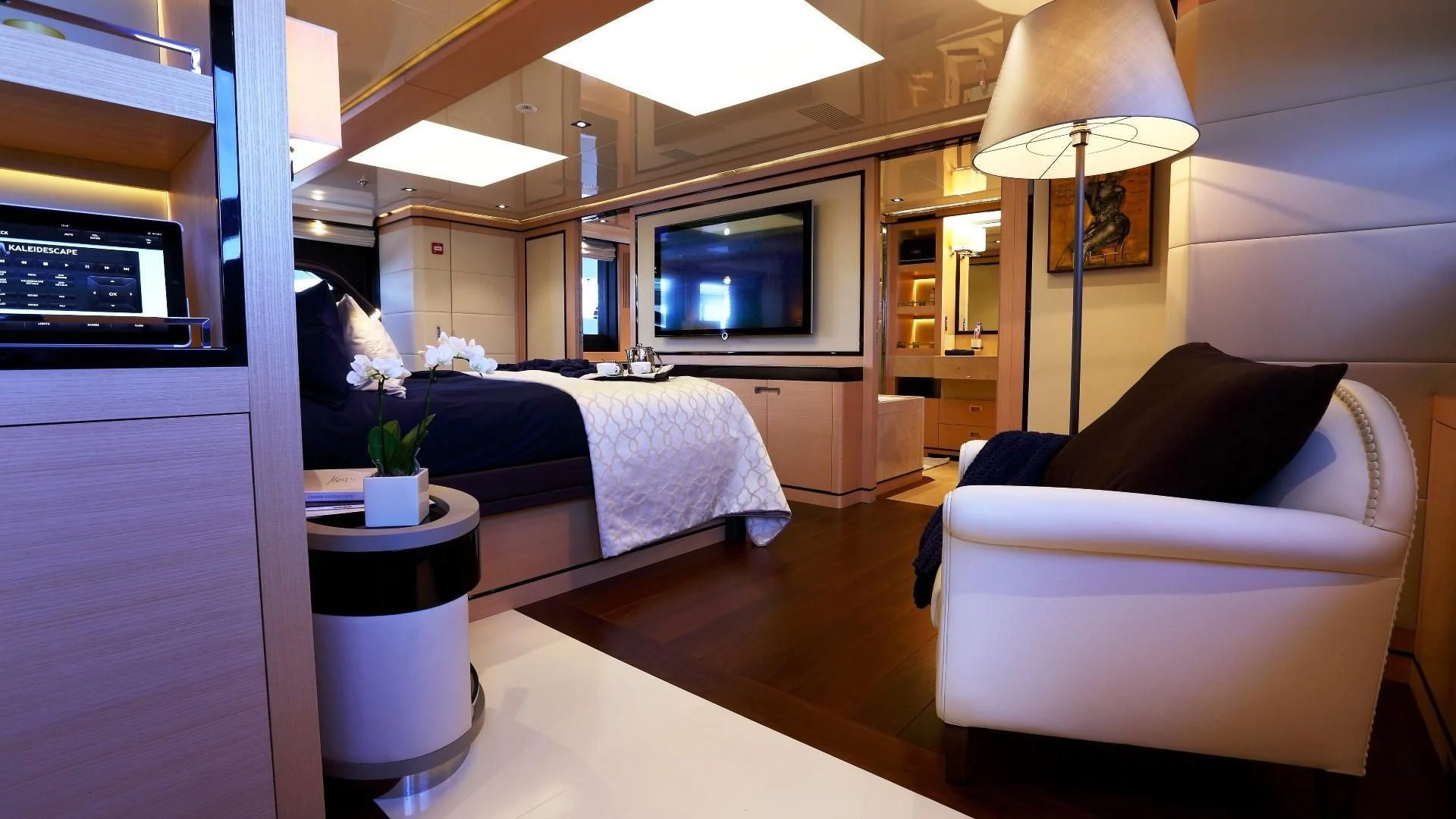 a bedroom with a bed and a couch aboard 2 LADIES Yacht for Sale