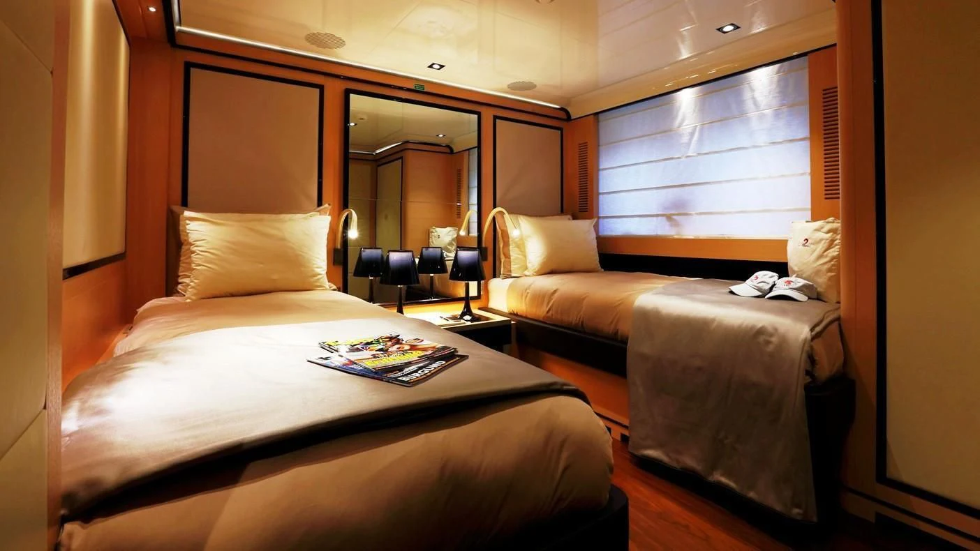 a hotel room with two beds aboard 2 LADIES Yacht for Sale