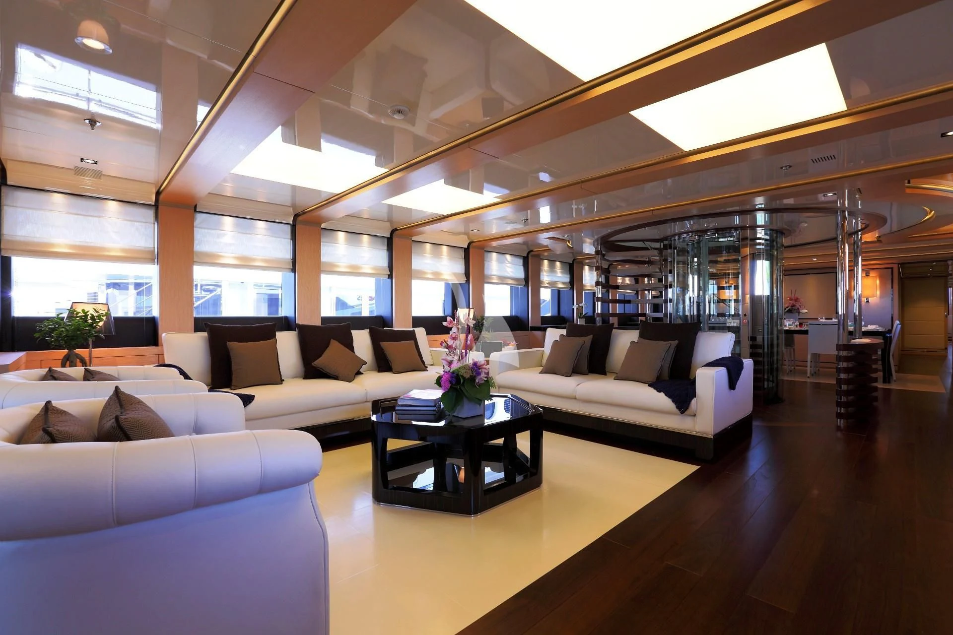 a room with couches and a table aboard 2 LADIES Yacht for Sale