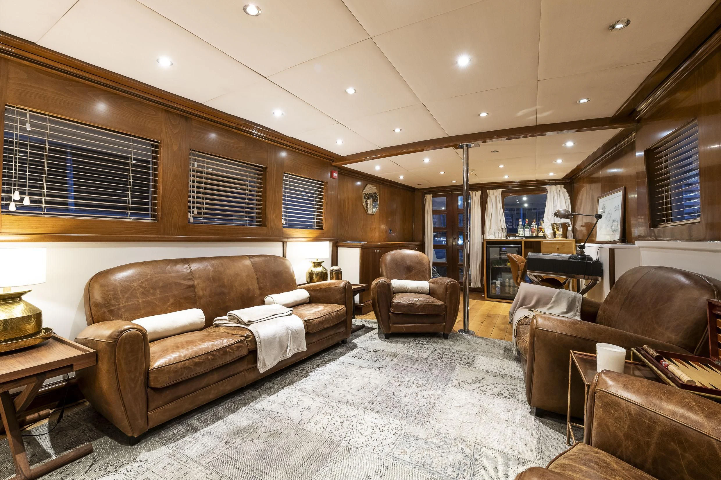 a living room with leather couches aboard 2 LADIES Yacht for Sale