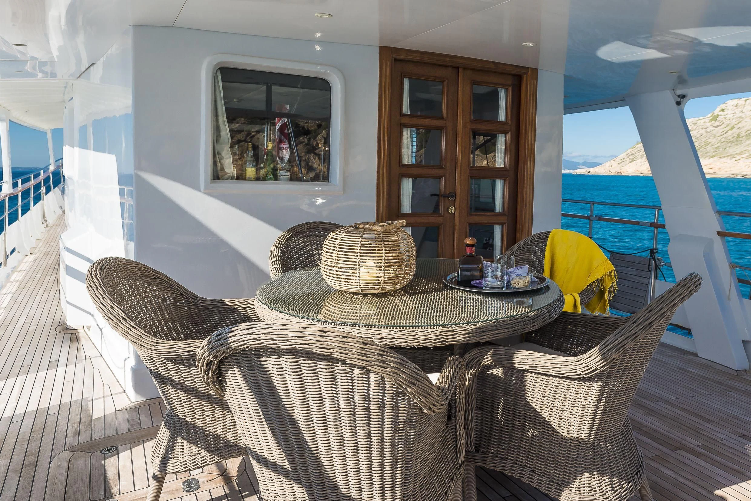 a wicker chair on a deck aboard 2 LADIES Yacht for Sale