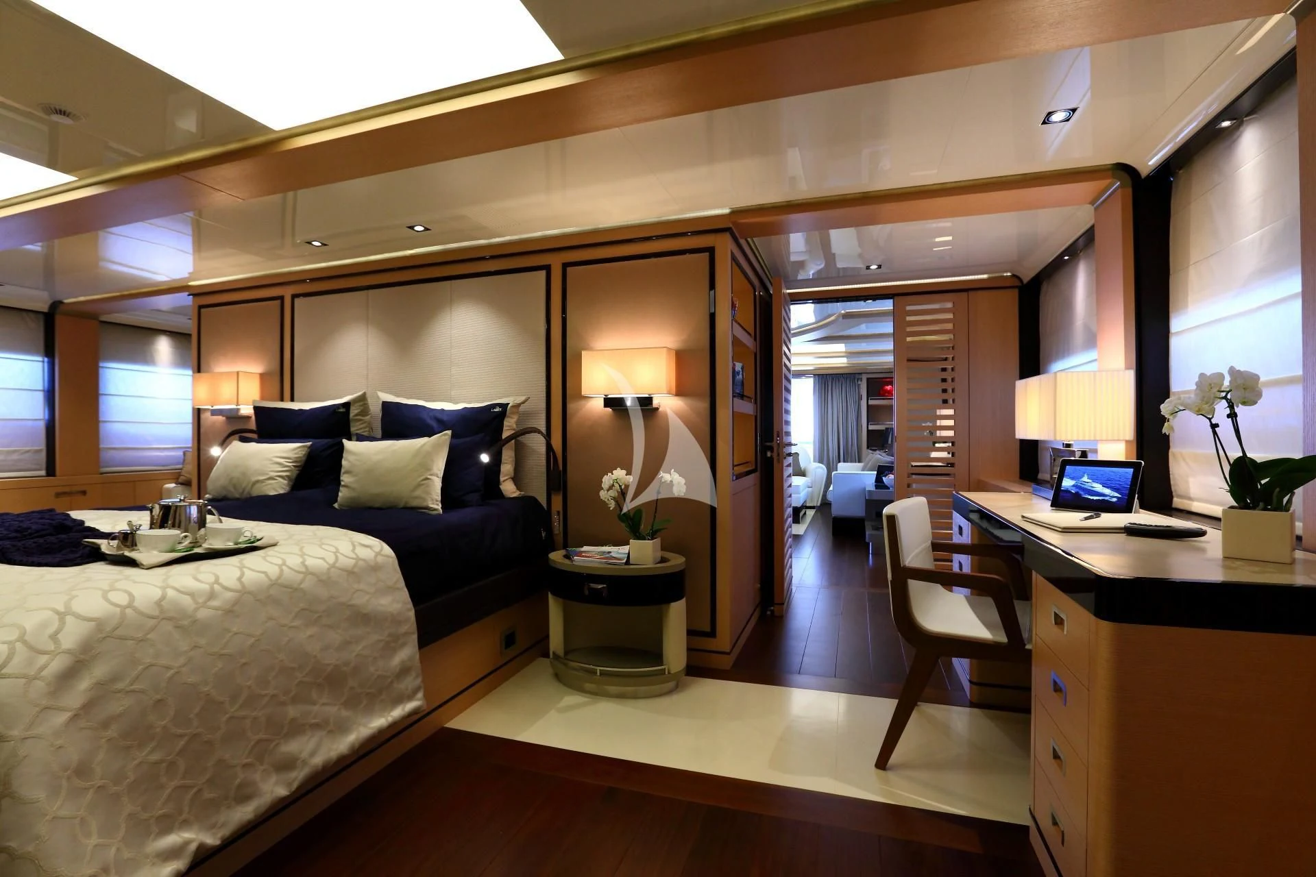 a bedroom with a bed and a desk aboard 2 LADIES Yacht for Sale