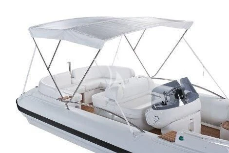 a white boat with a white canopy aboard 2 LADIES Yacht for Sale