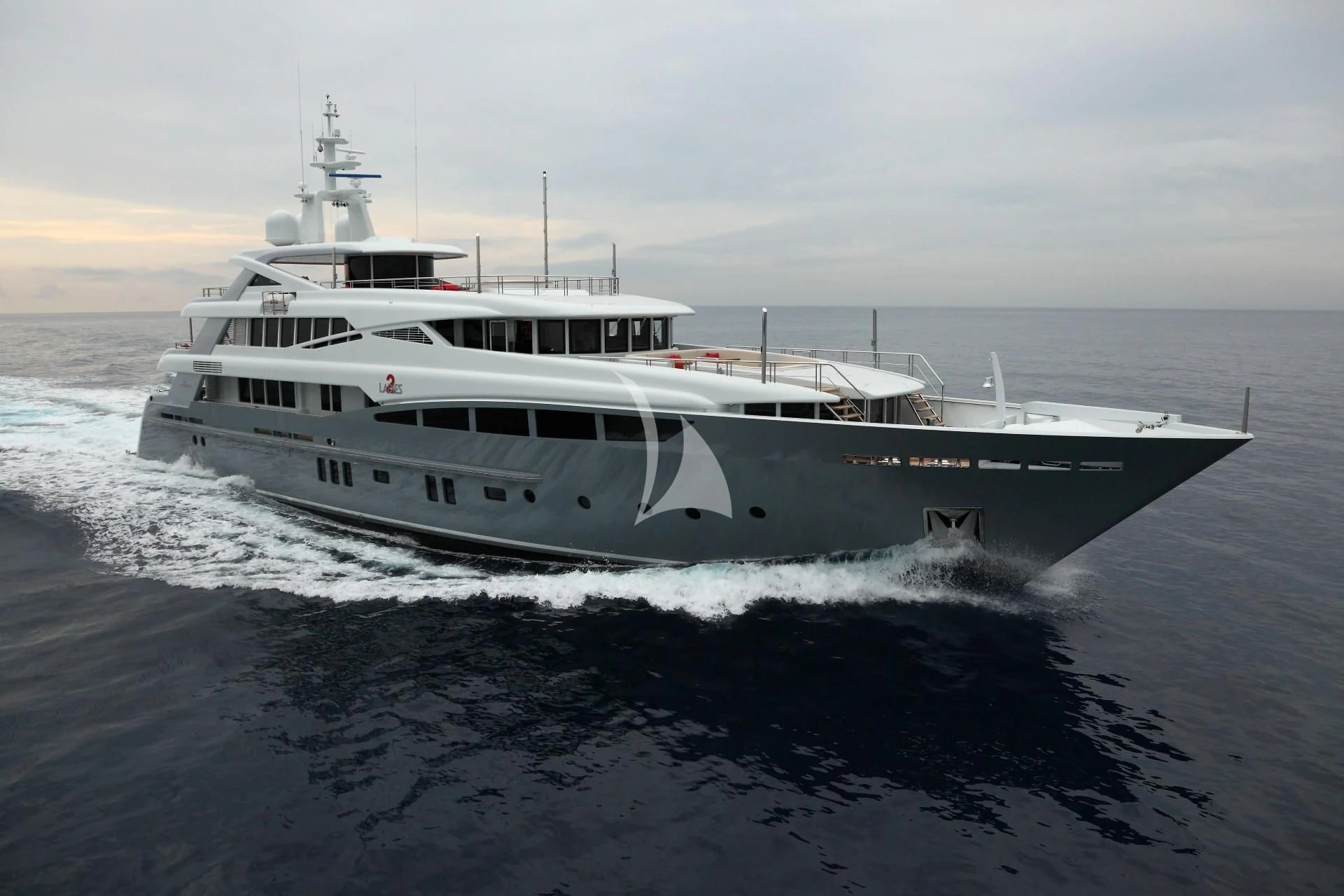 a large white boat on the water aboard 2 LADIES Yacht for Sale