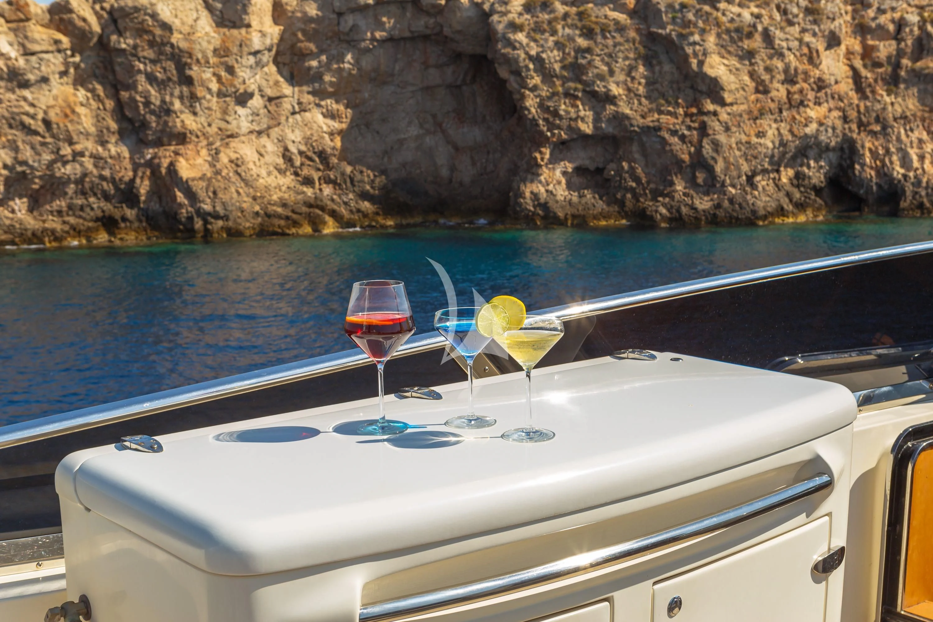 a couple of glasses on a boat aboard VYNO Yacht for Sale