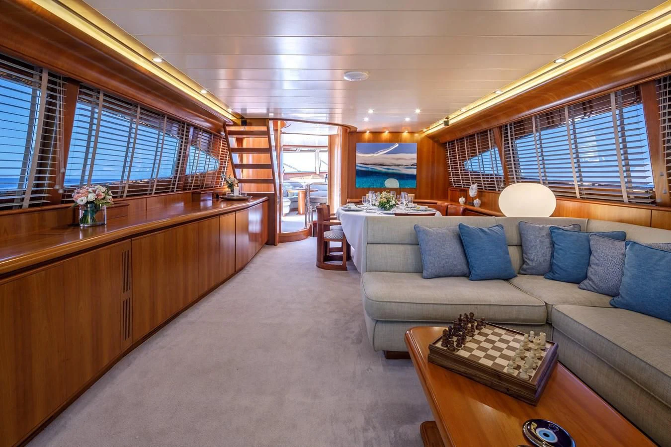 a large living room with a large window aboard VYNO Yacht for Sale