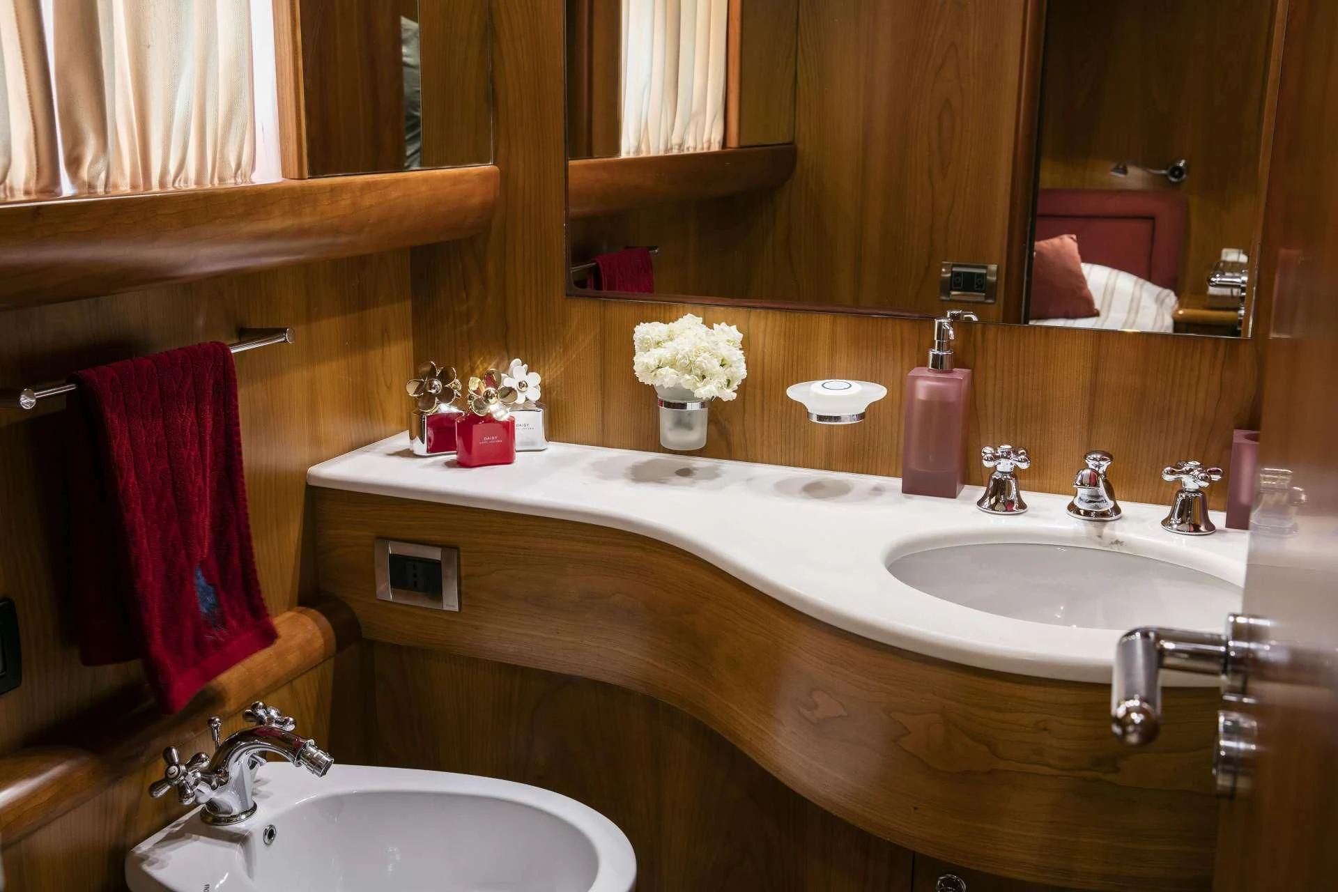 a bathroom with a sink and a mirror aboard VYNO Yacht for Sale