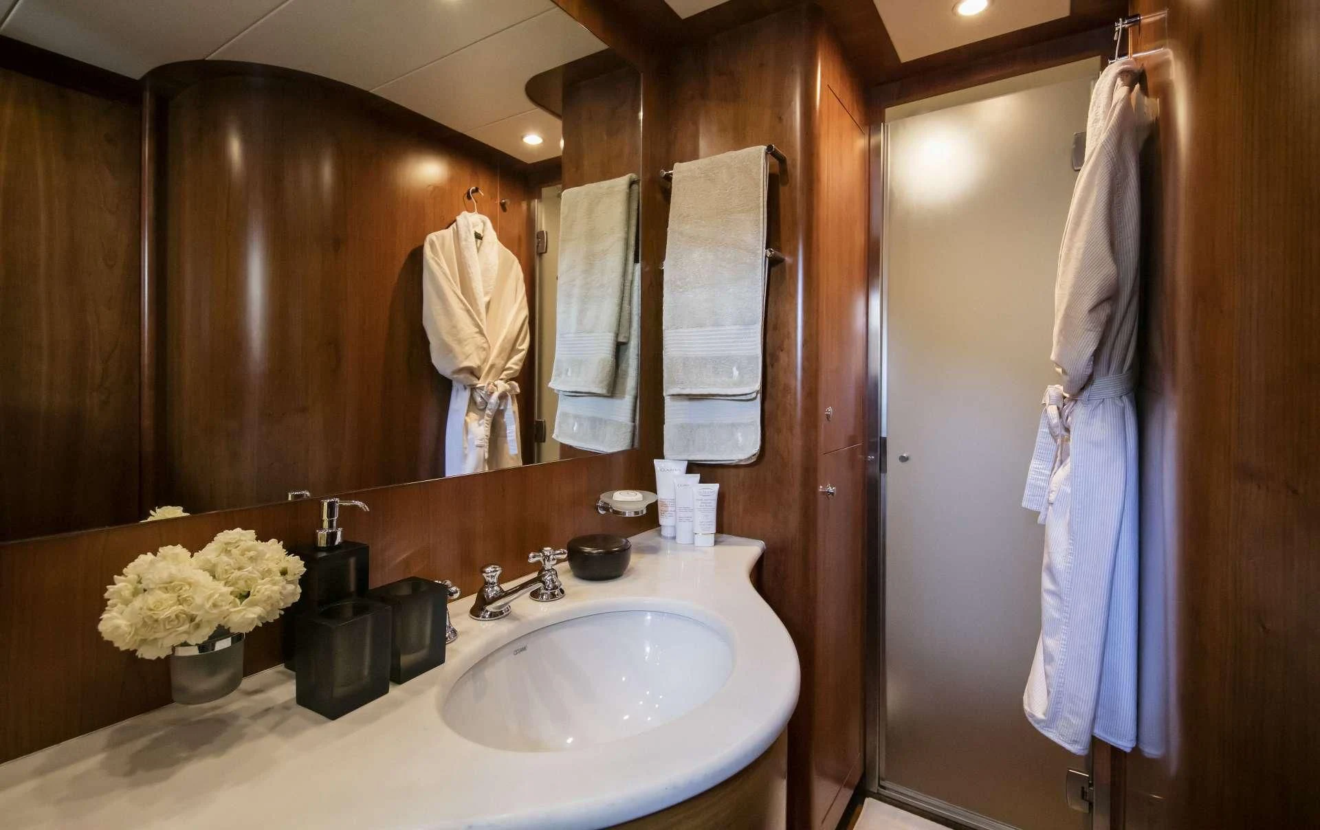 a bathroom with a large mirror aboard VYNO Yacht for Sale