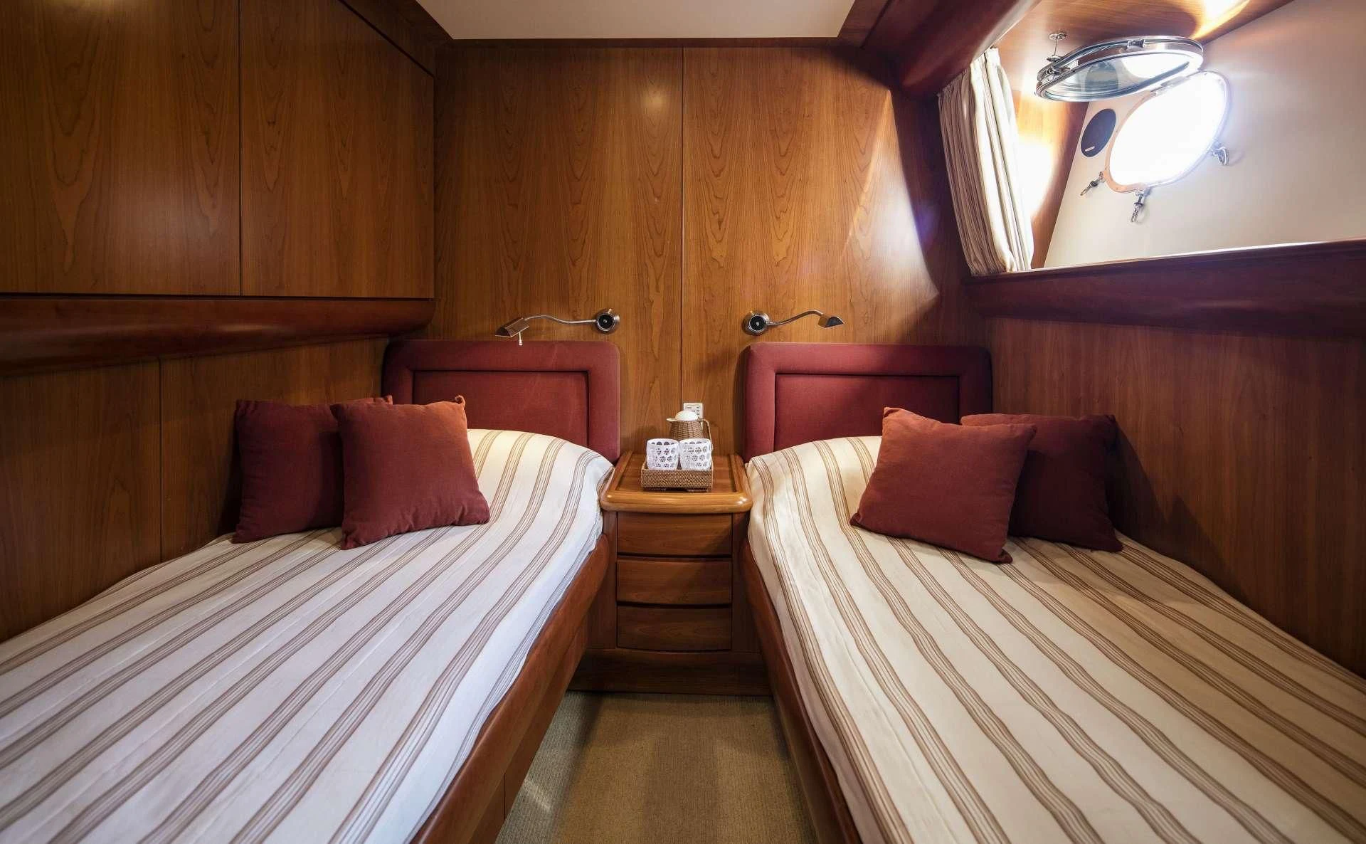 a room with two beds aboard VYNO Yacht for Sale