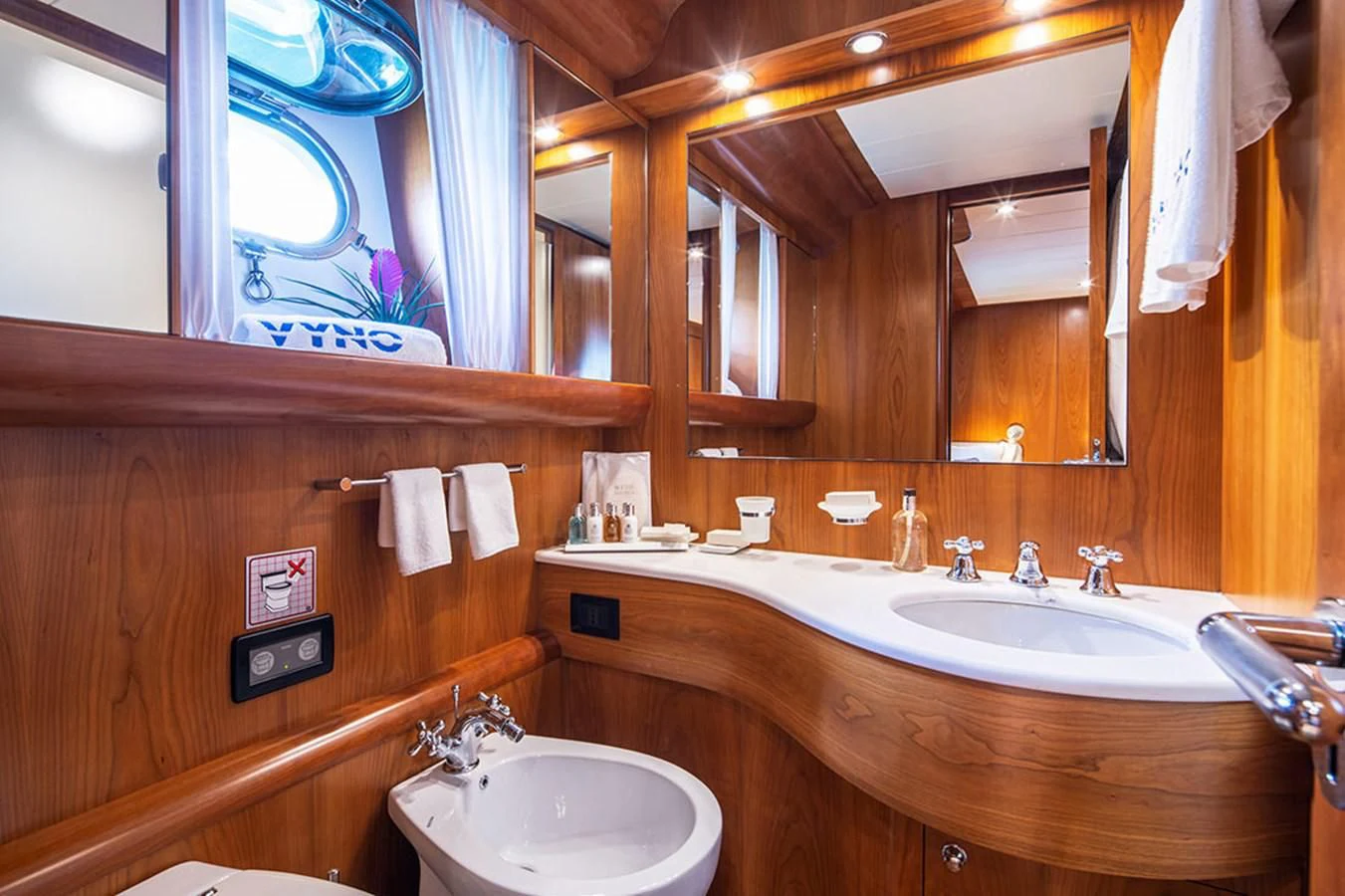 a bathroom with a large mirror aboard VYNO Yacht for Sale