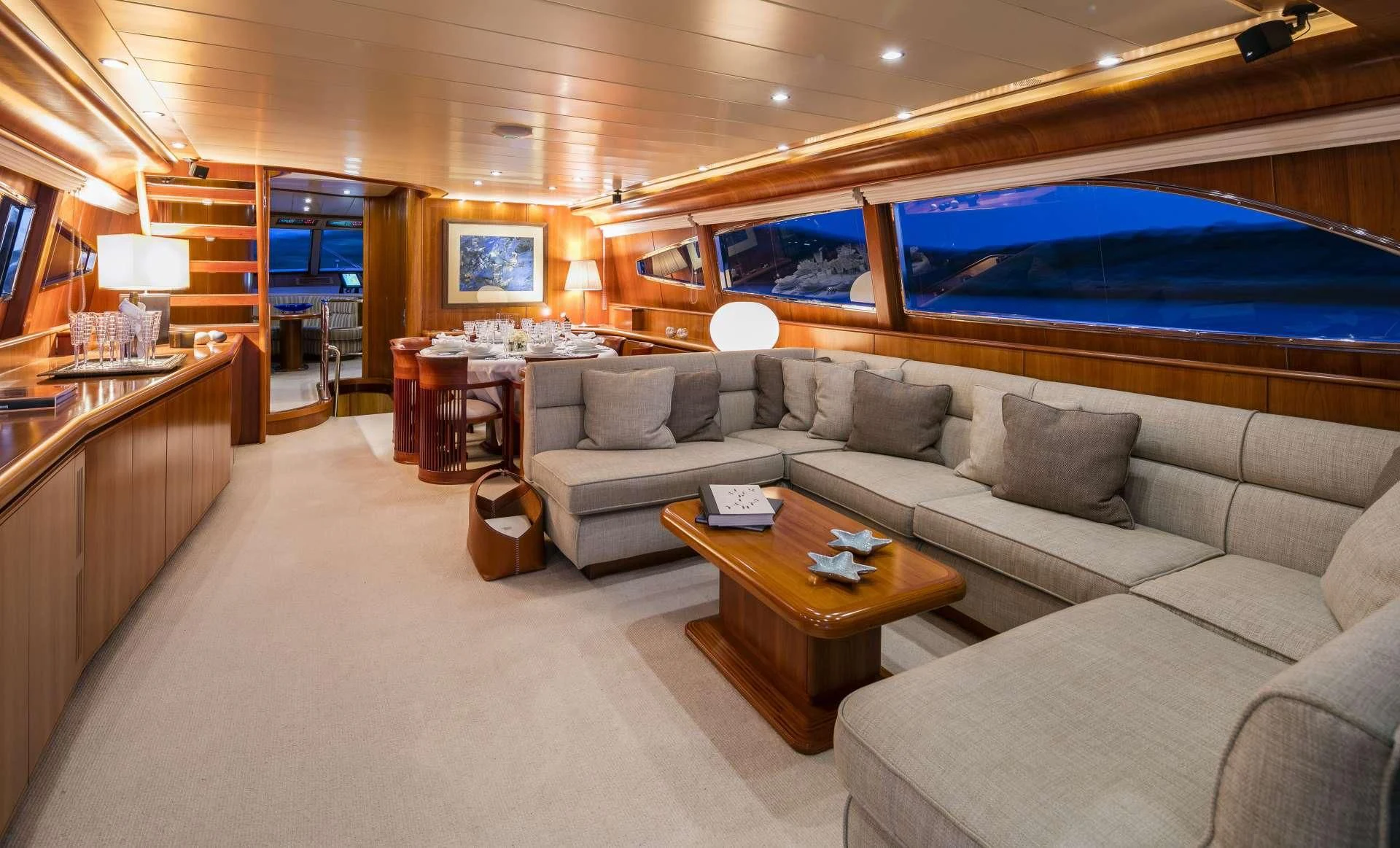 a living room with a large sofa aboard VYNO Yacht for Sale