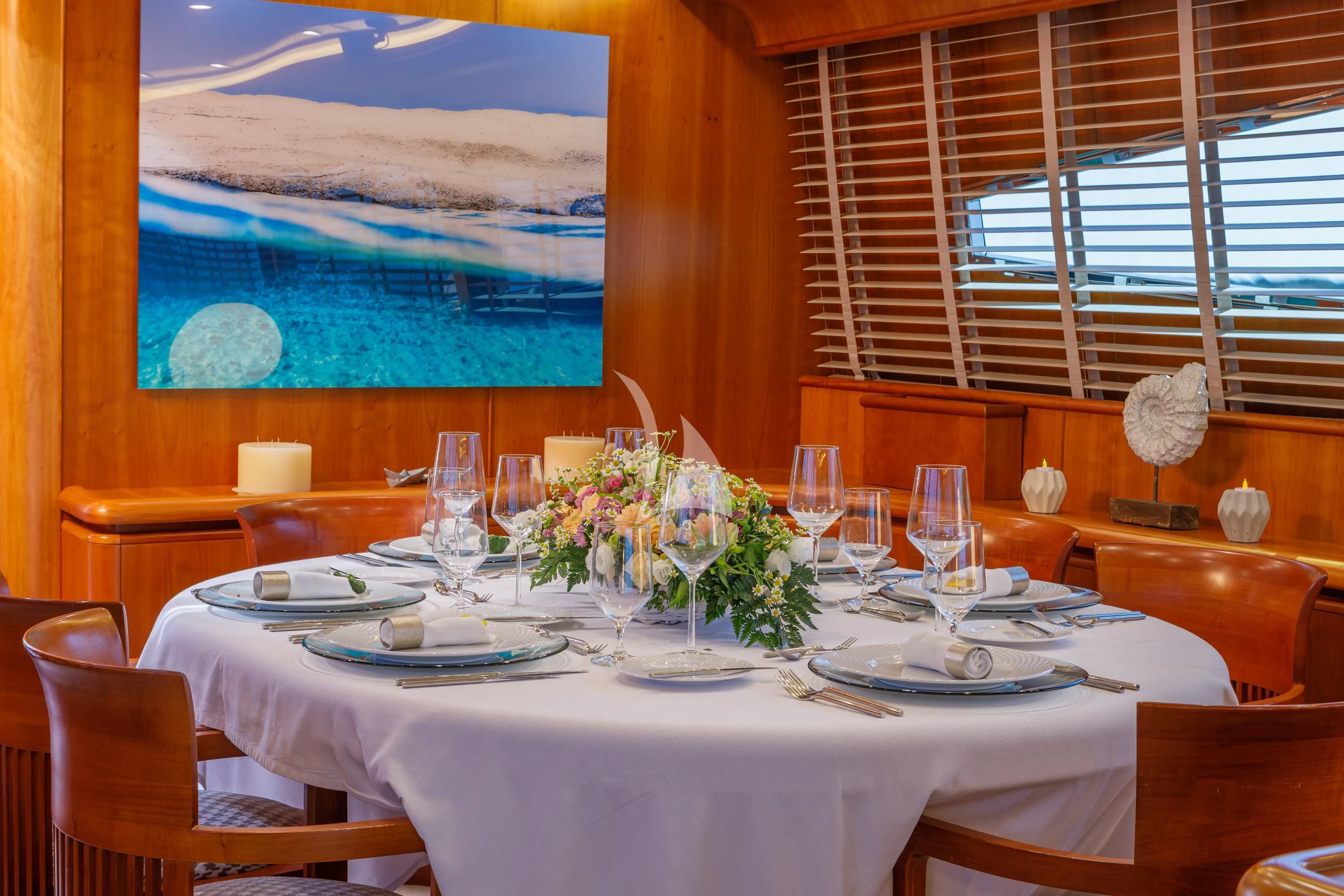 a table set for a dinner aboard VYNO Yacht for Sale