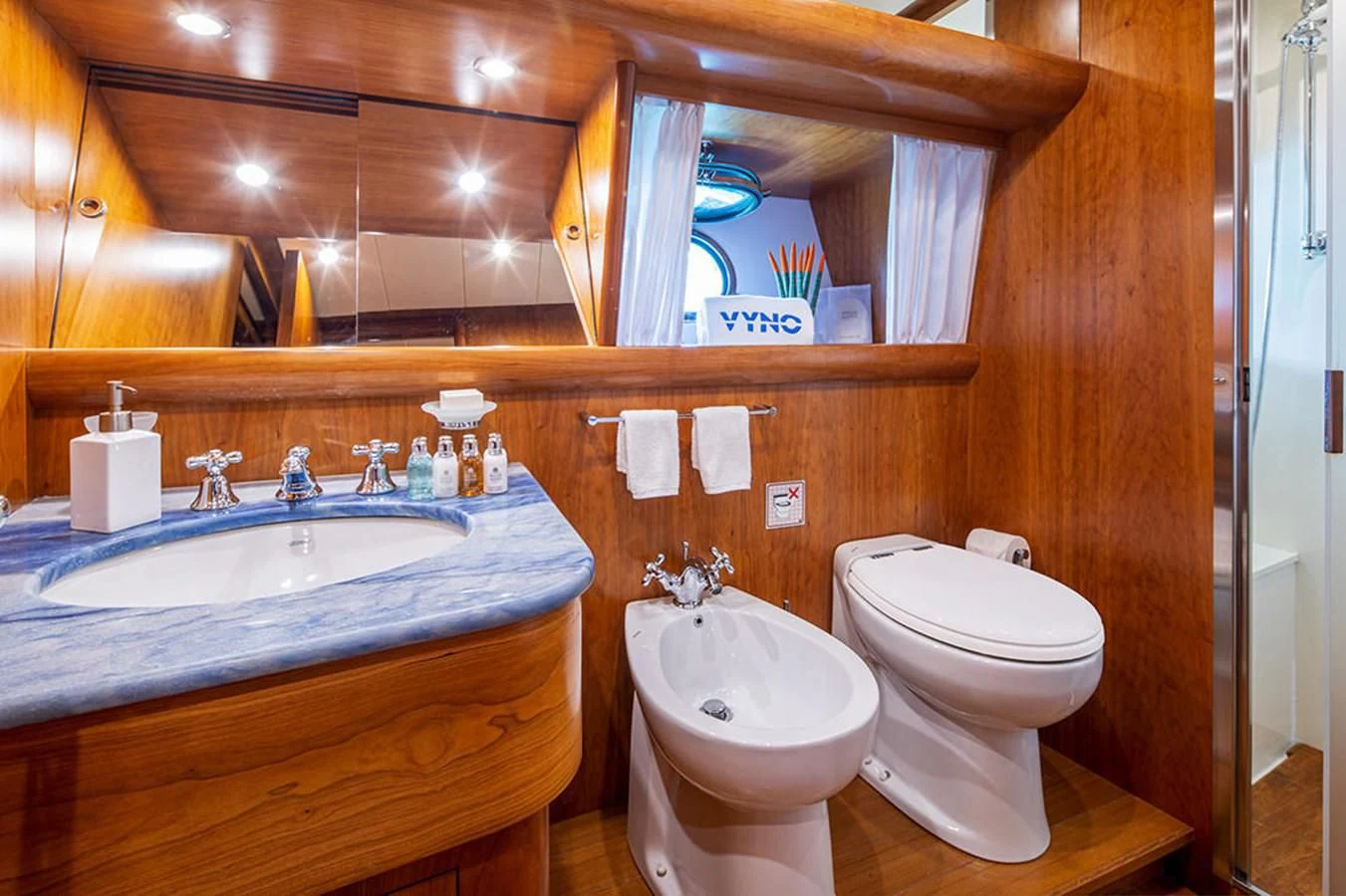 a bathroom with a sink and toilet aboard VYNO Yacht for Sale
