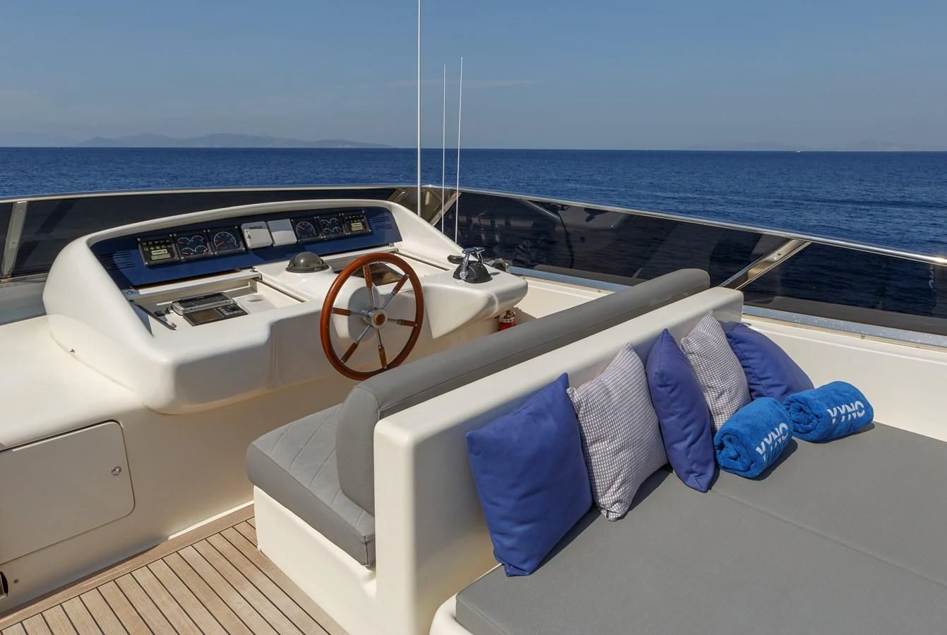 a boat with a seat on the deck aboard VYNO Yacht for Sale