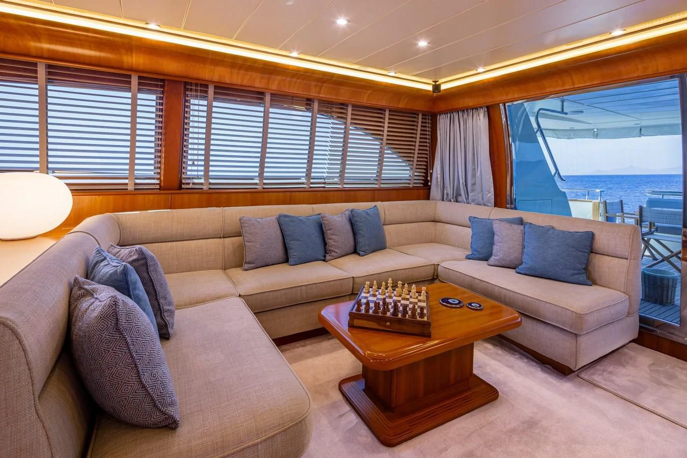 a living room with a couch and a table aboard VYNO Yacht for Sale
