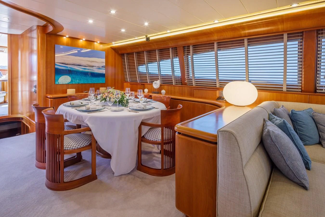 a dining table in a room aboard VYNO Yacht for Sale