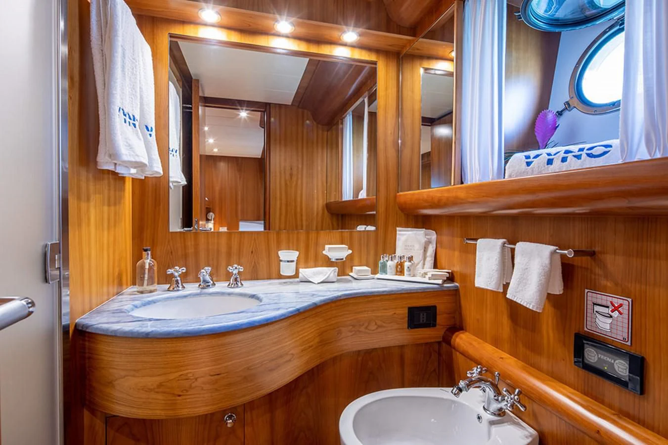 a bathroom with a large mirror aboard VYNO Yacht for Sale