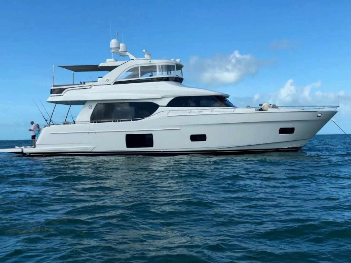 a white yacht in the water aboard JOHN BOAT Yacht for Sale