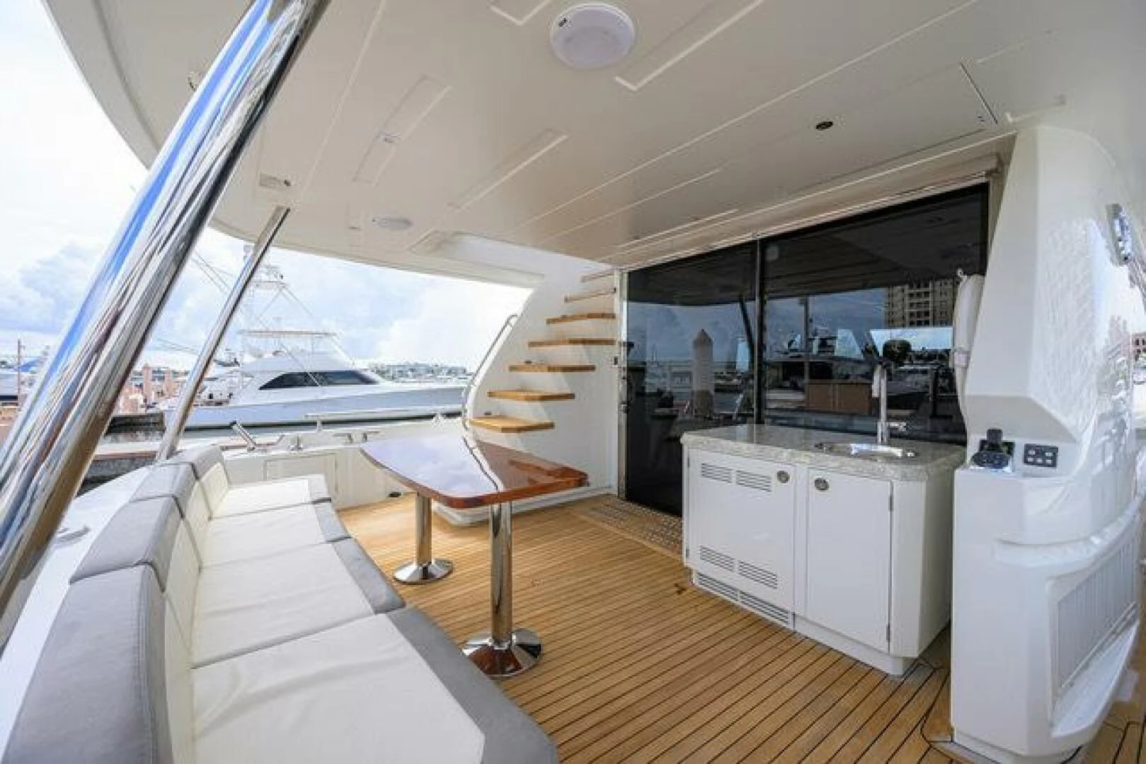 a room with a bed and a table aboard JOHN BOAT Yacht for Sale