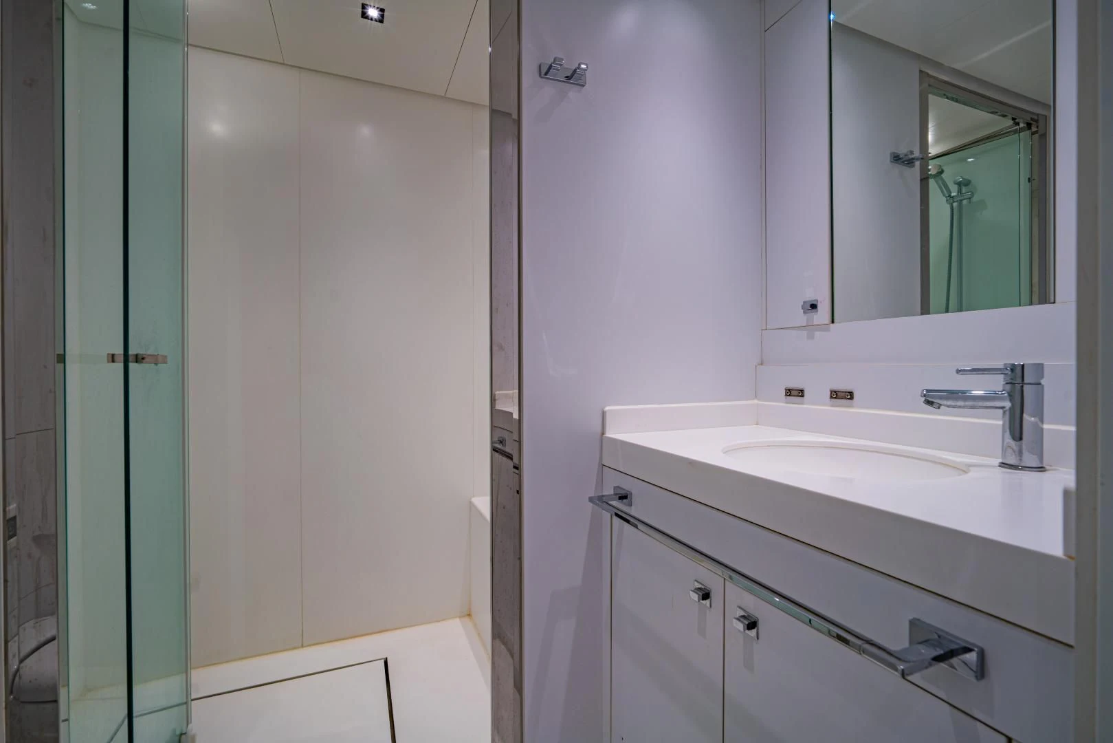 a bathroom with a sink and a mirror aboard LA VIE Yacht for Sale