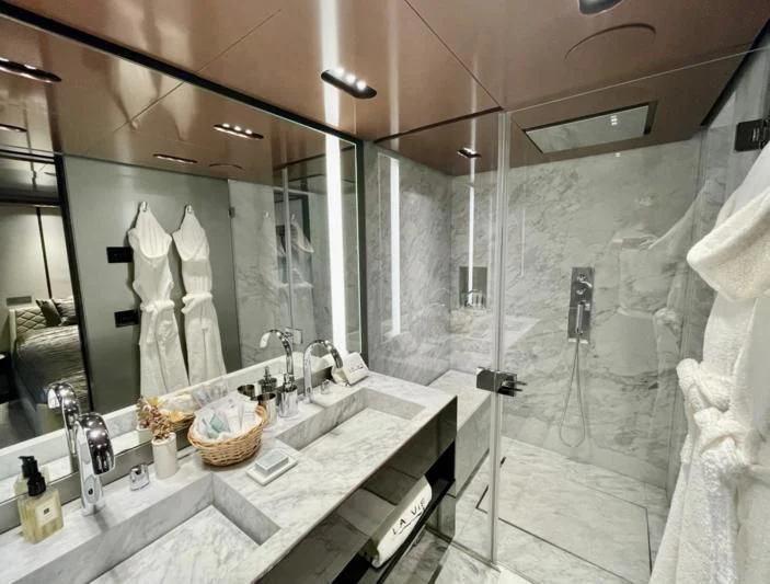 a bathroom with a large mirror aboard LA VIE Yacht for Sale