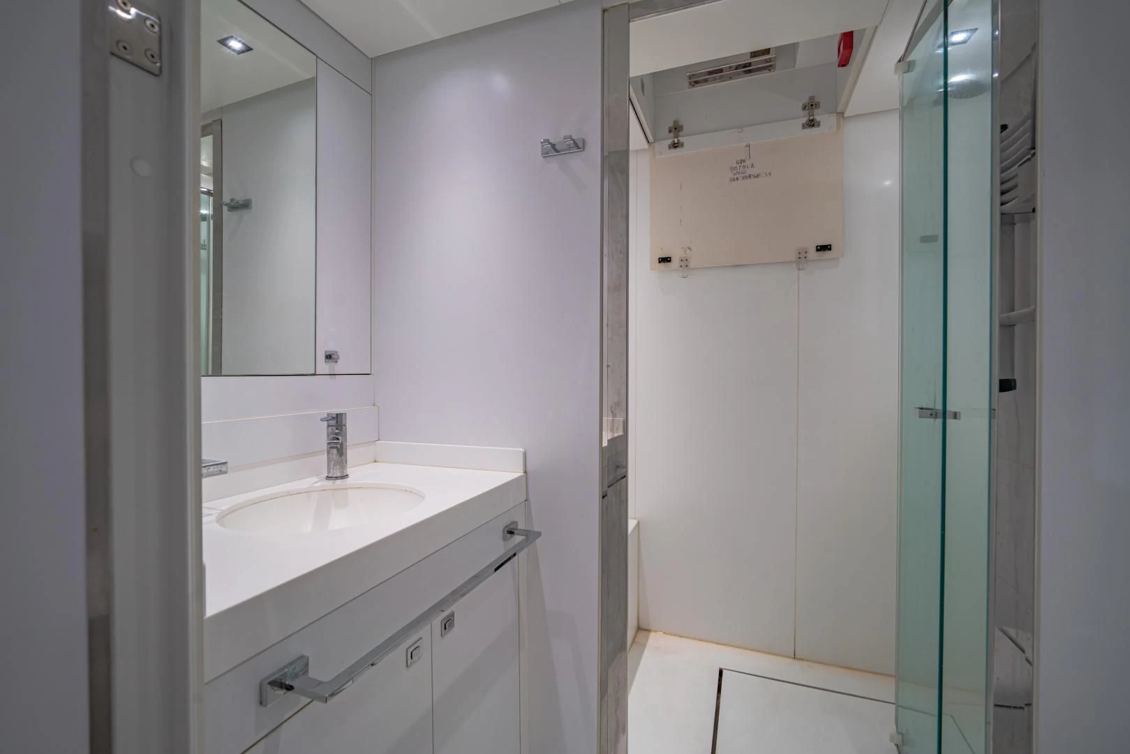 a bathroom with a sink and mirror aboard LA VIE Yacht for Sale