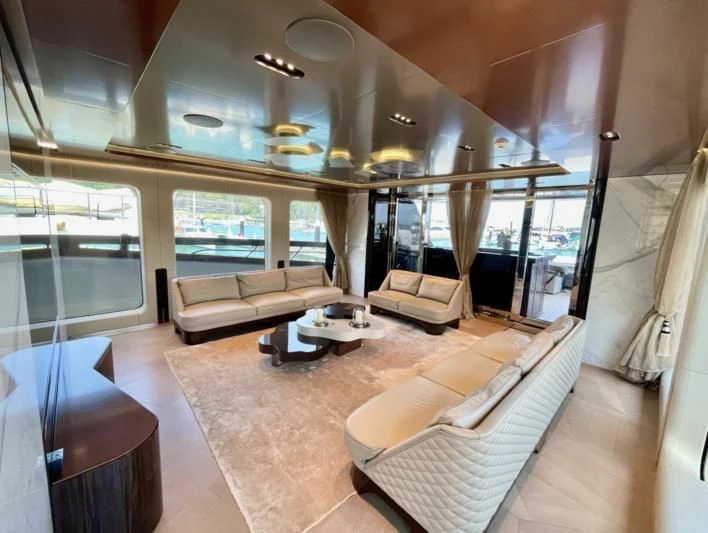 a room with a couch and a table aboard LA VIE Yacht for Sale