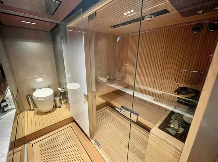 a bathroom with a glass shower aboard LA VIE Yacht for Sale