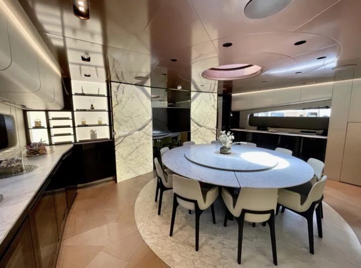 a room with a table and chairs aboard LA VIE Yacht for Sale
